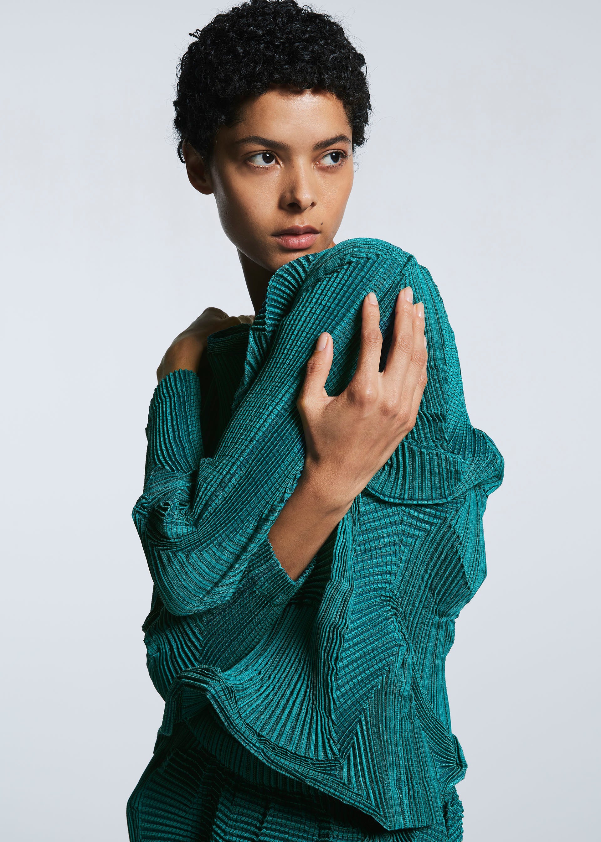 A model wears the A-POC ABLE ISSEY MIYAKE TYPE O 003 1 shirt.