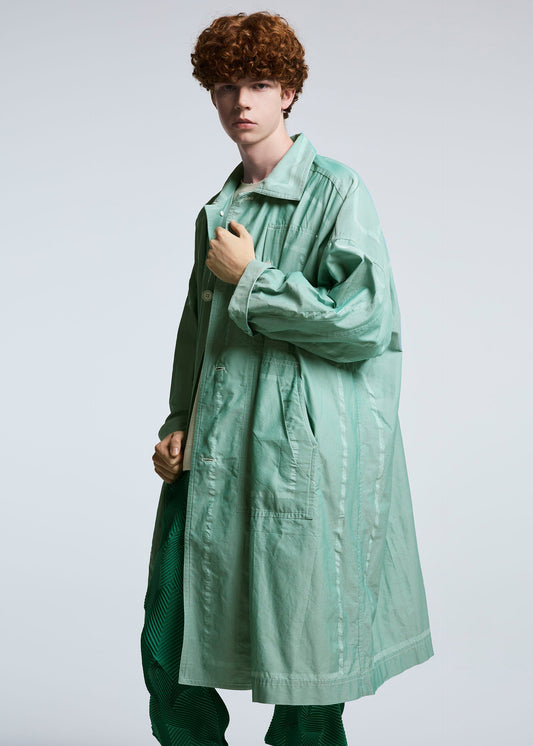 A model wears the A-POC ABLE ISSEY MIYAKE TYPE U 002 coat.