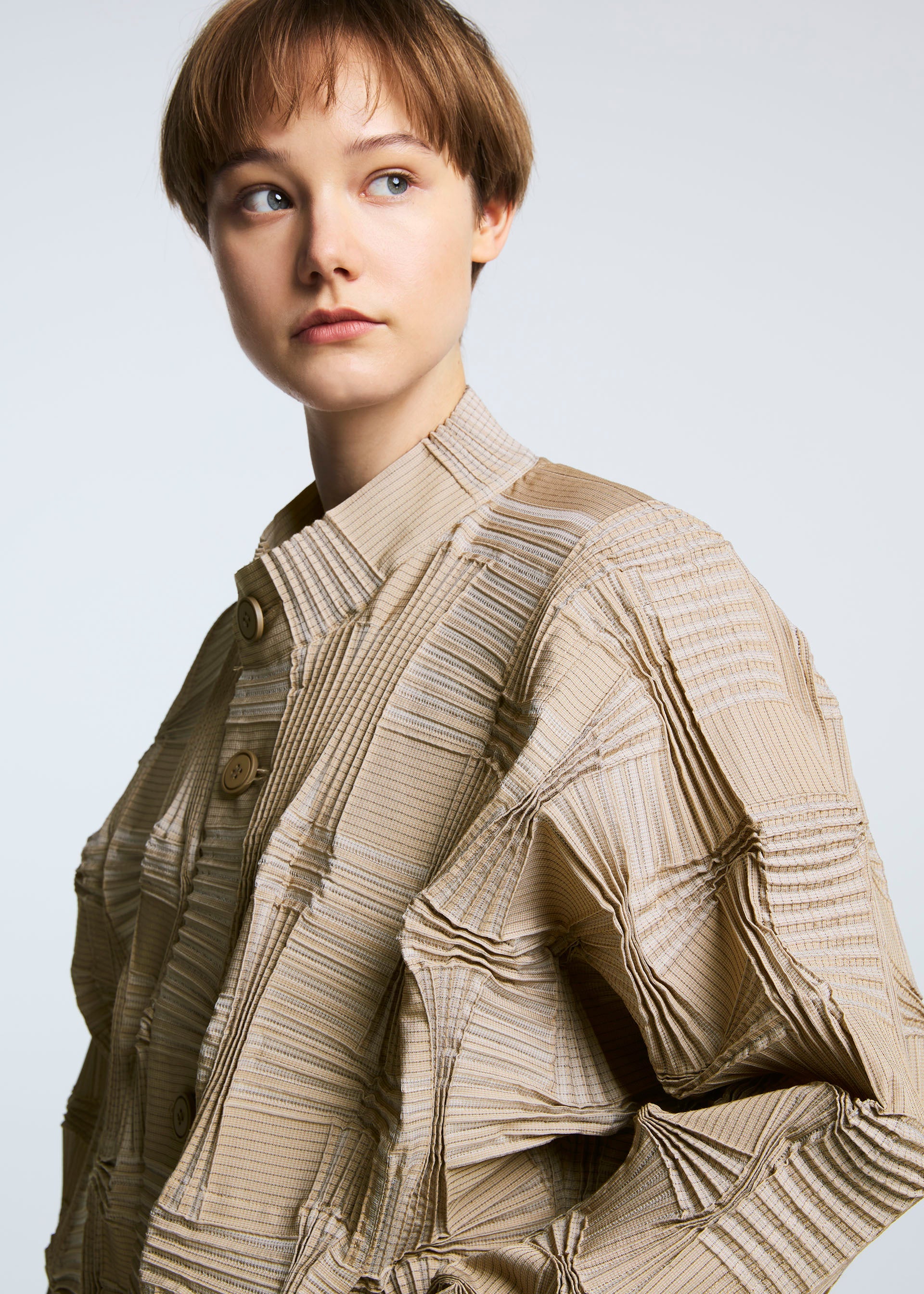 A model wears the A-POC ABLE ISSEY MIYAKE TYPE O 018 jacket.