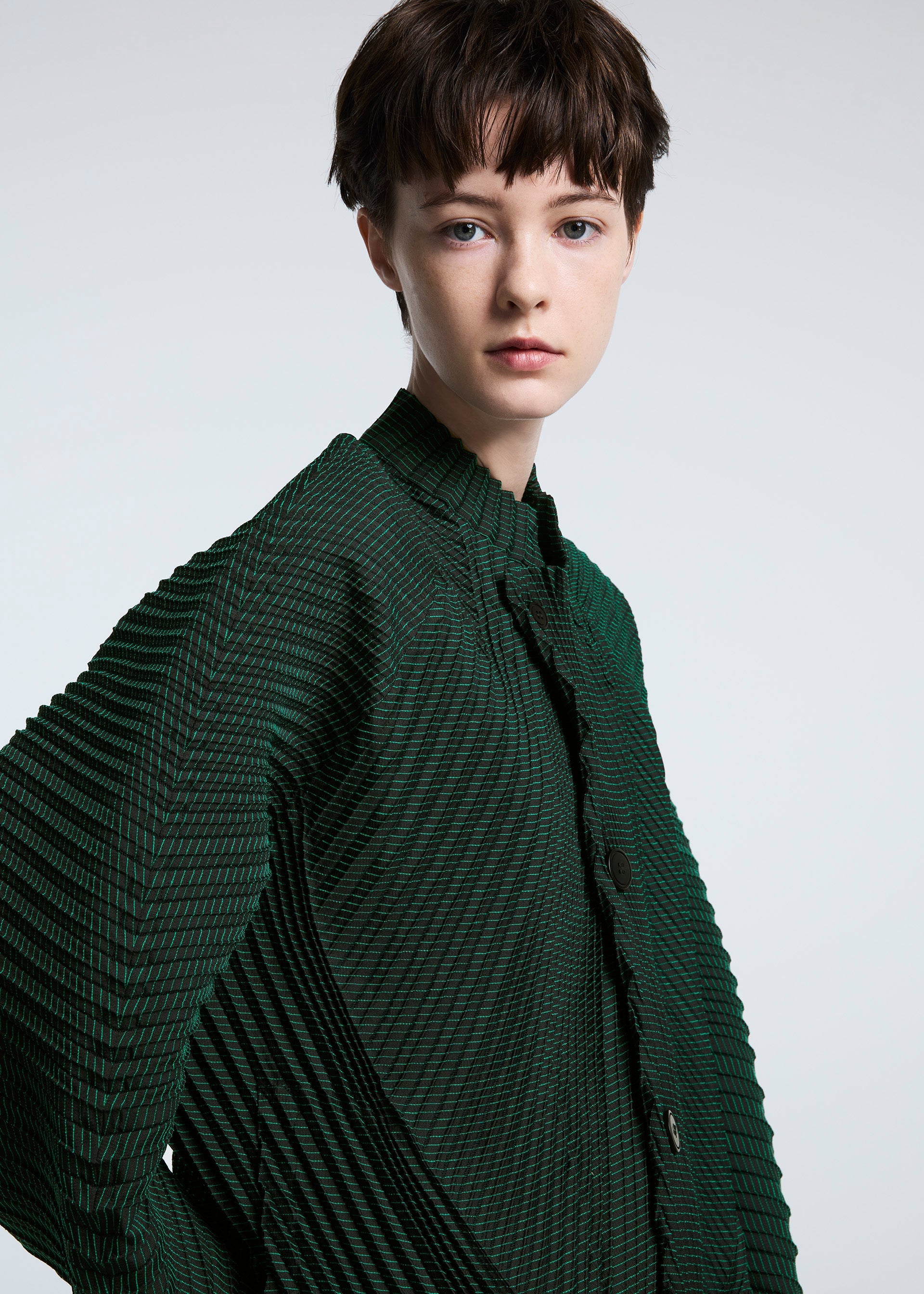 A model wears the A-POC ABLE ISSEY MIYAKE TYPE O 006 jacket.