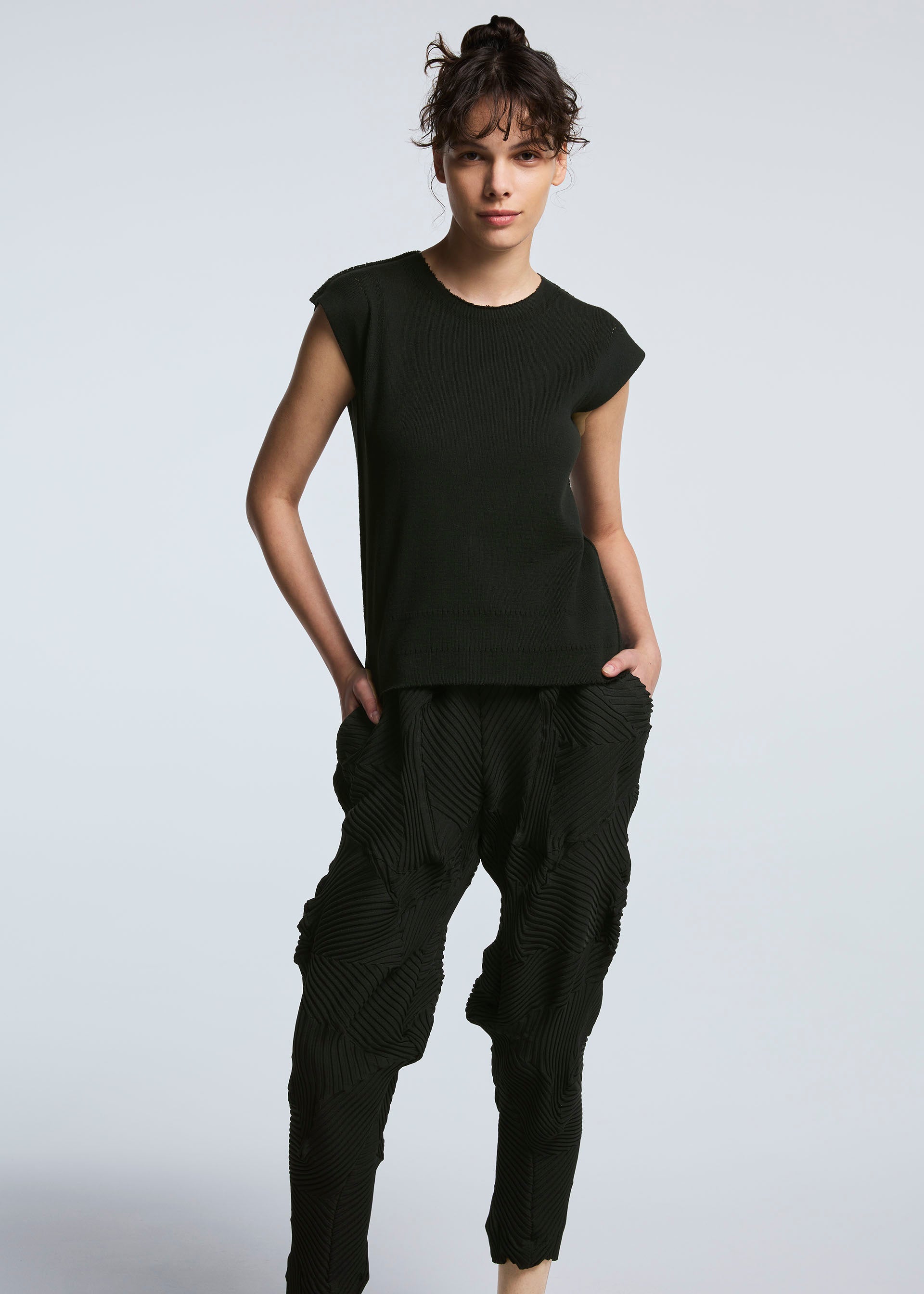 A model wears the A-POC ABLE ISSEY MIYAKE TYPE P 003 trousers.