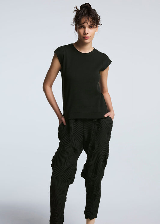 A model wears the A-POC ABLE ISSEY MIYAKE TYPE P 003 trousers.