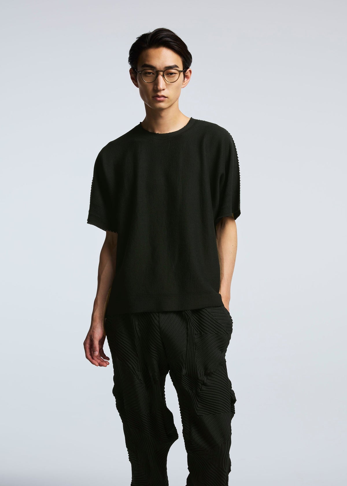 A model wears the A-POC ABLE ISSEY MIYAKE TYPE P 003 trousers.
