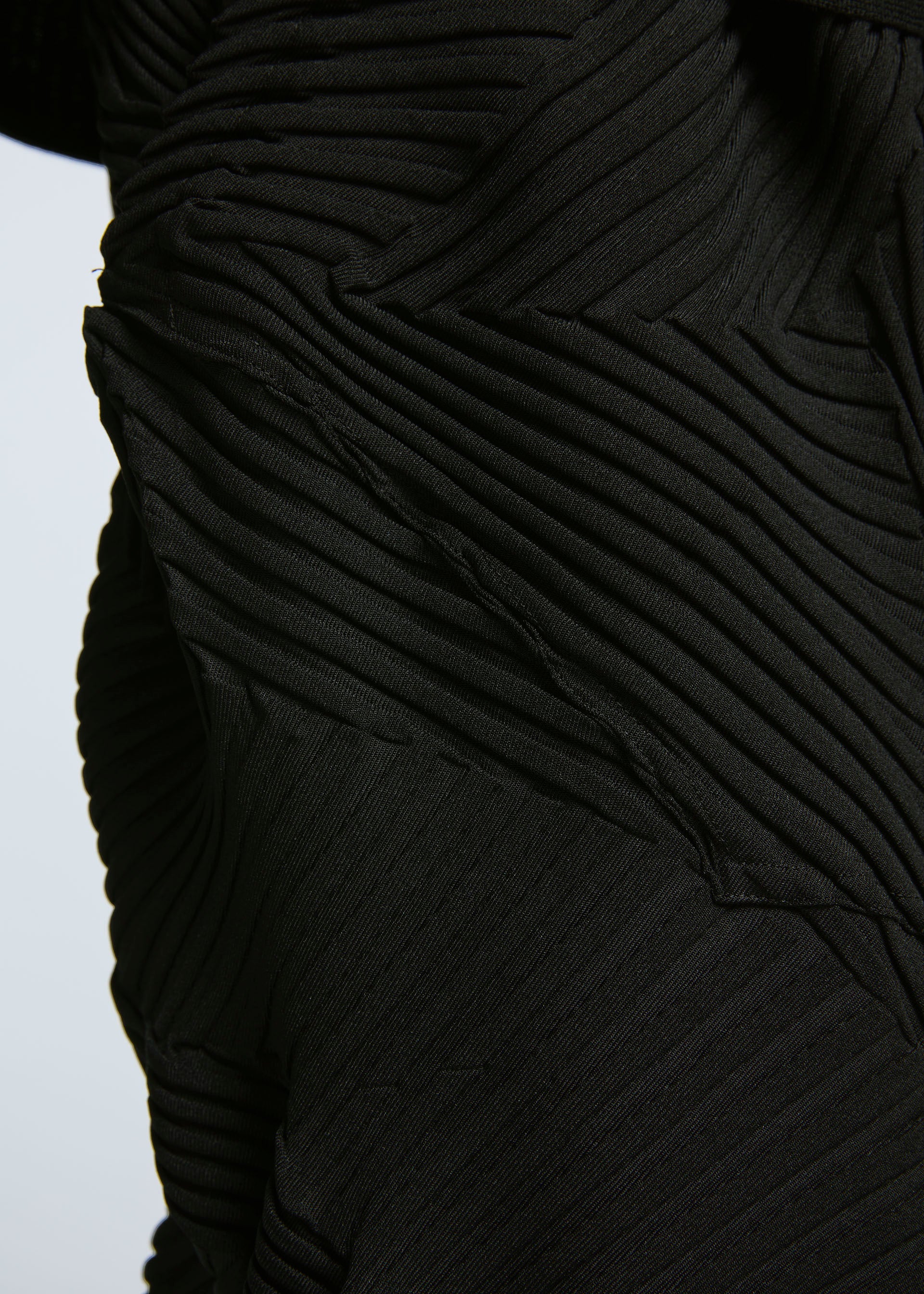 A model wears the A-POC ABLE ISSEY MIYAKE TYPE P 003 trousers.