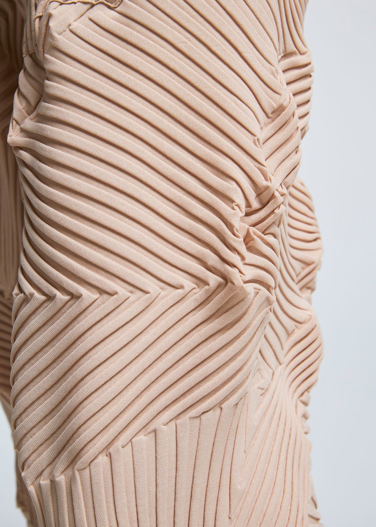 A model wears the A-POC ABLE ISSEY MIYAKE TYPE P 003 trousers.