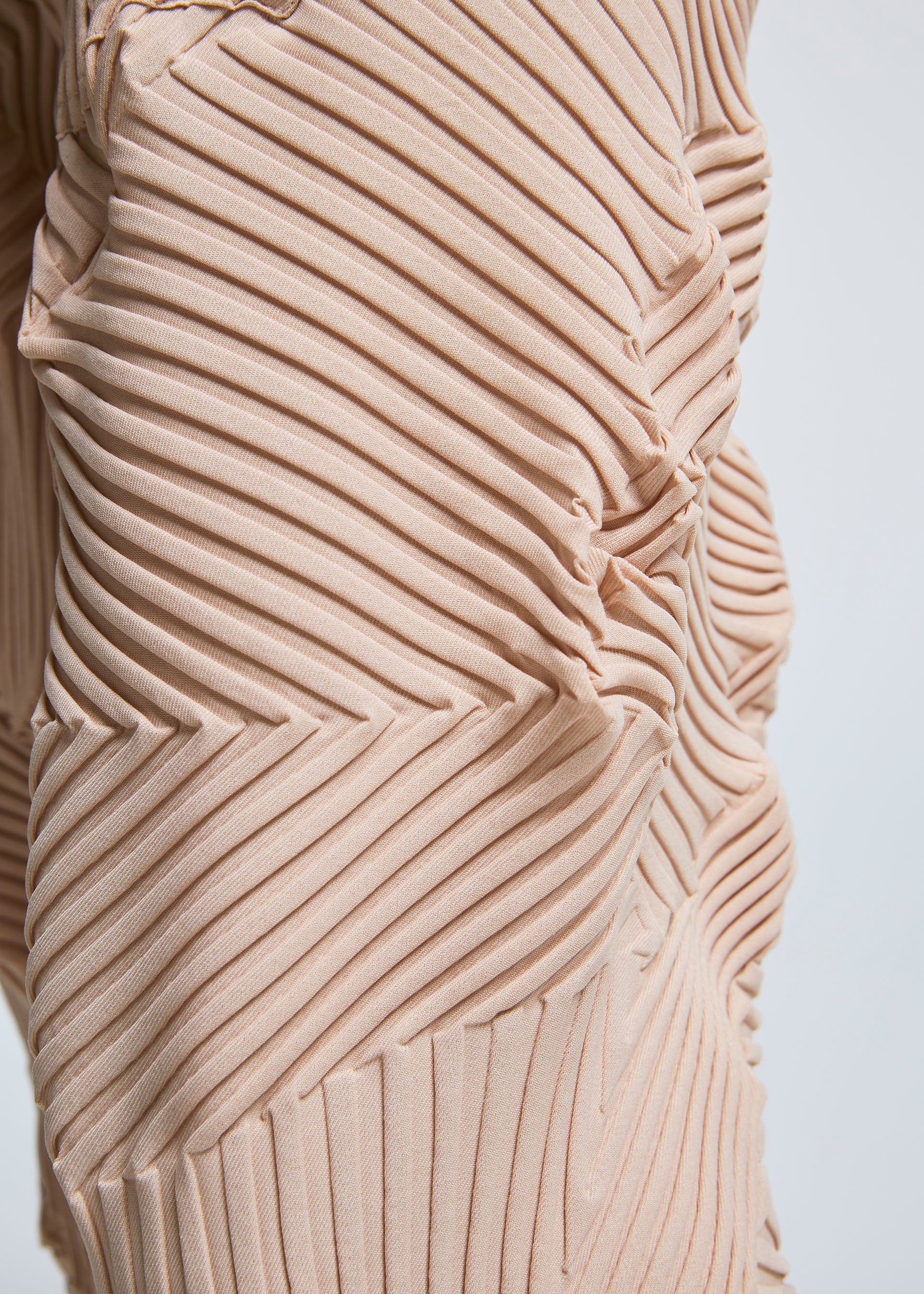 A model wears the A-POC ABLE ISSEY MIYAKE TYPE P 003 trousers.