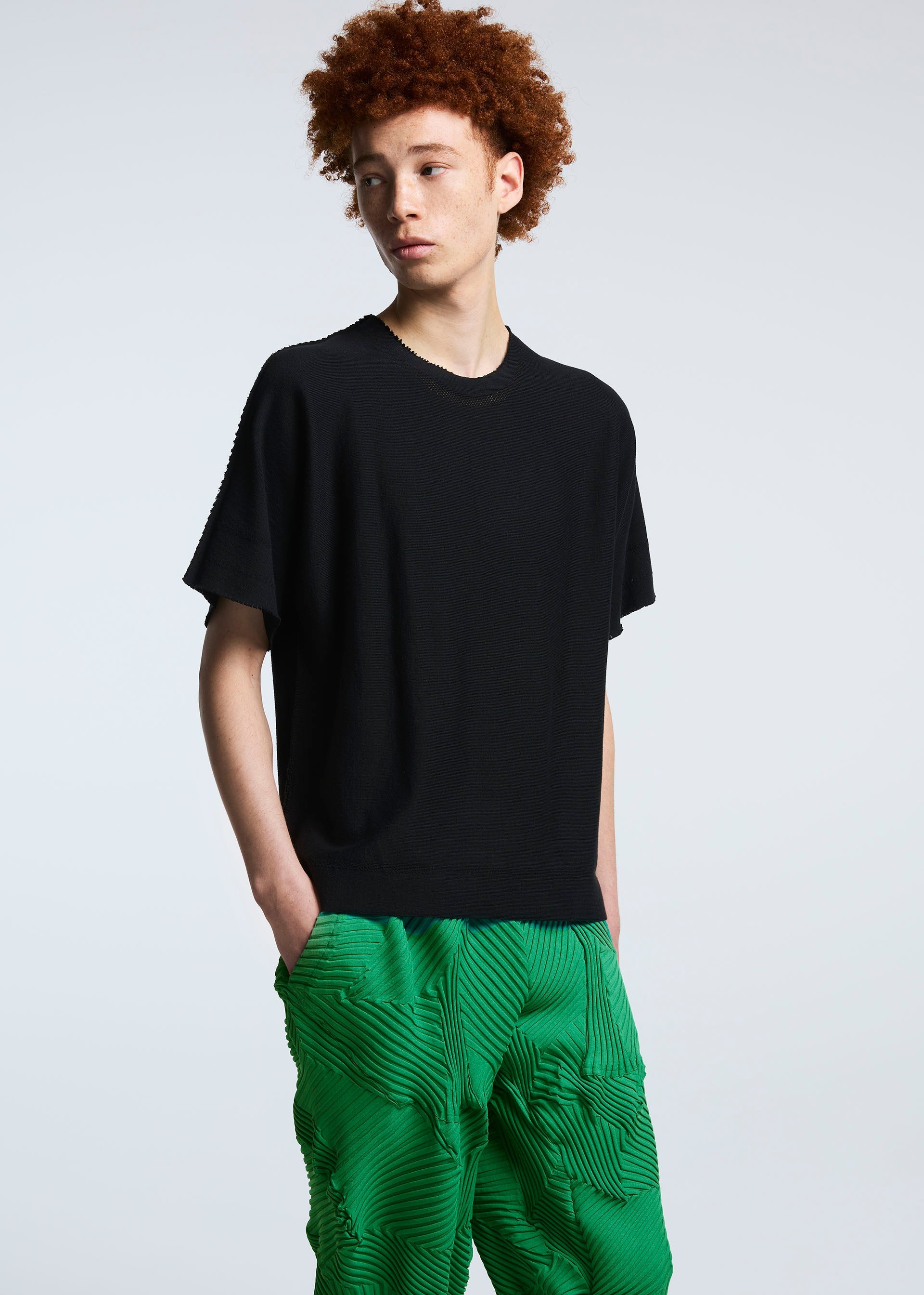 A model wears the A-POC ABLE ISSEY MIYAKE TYPE P 003 trousers.