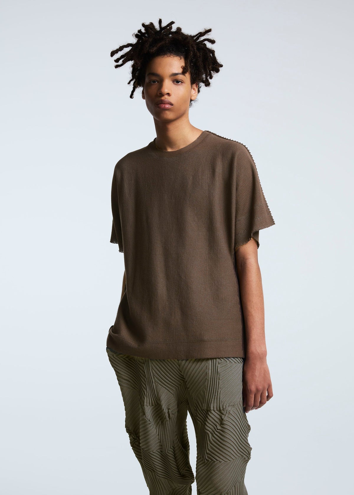 A model wears the A-POC ABLE ISSEY MIYAKE TYPE P 003 trousers.