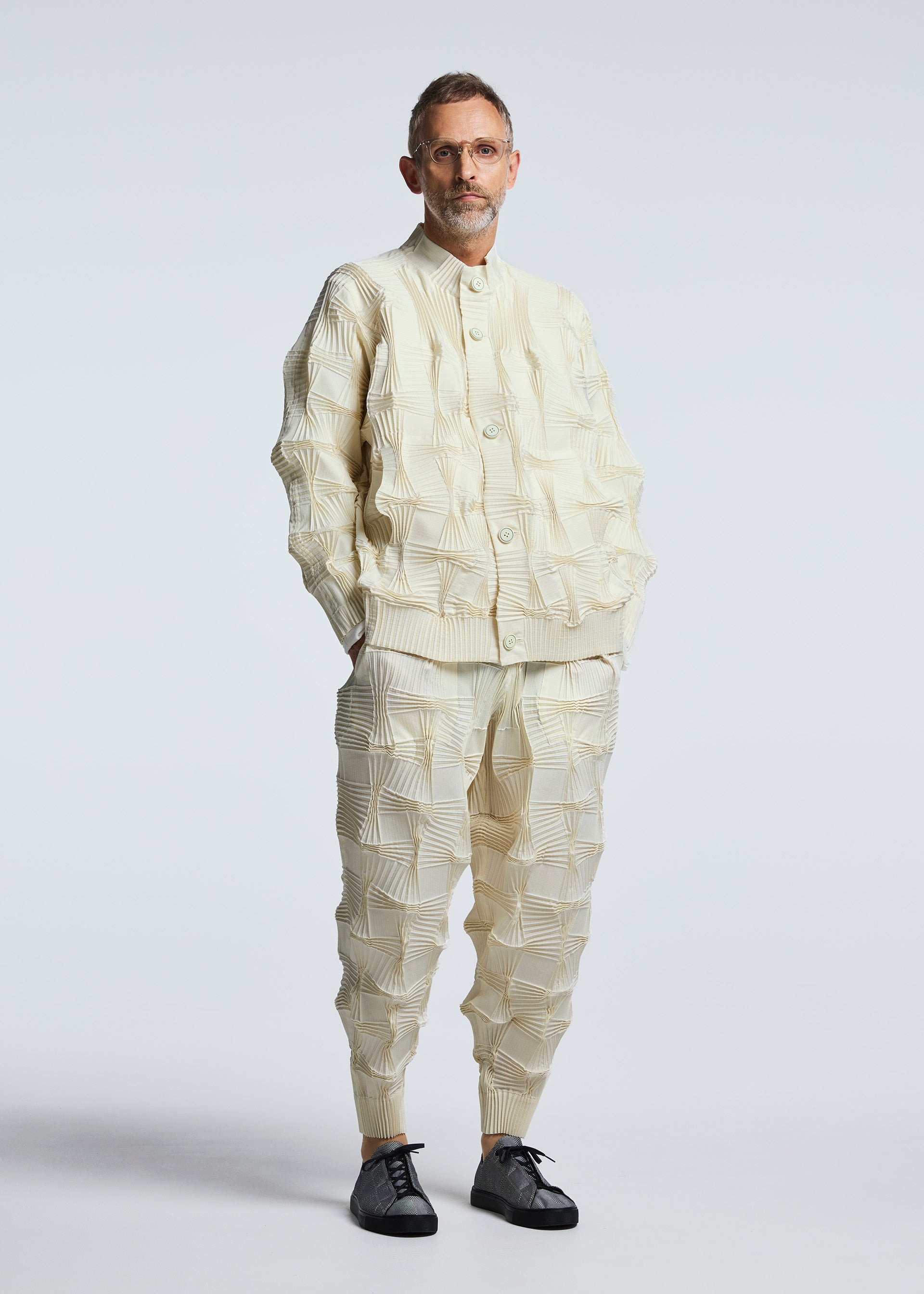 A model wears the A-POC ABLE ISSEY MIYAKE TYPE O 018 trousers.