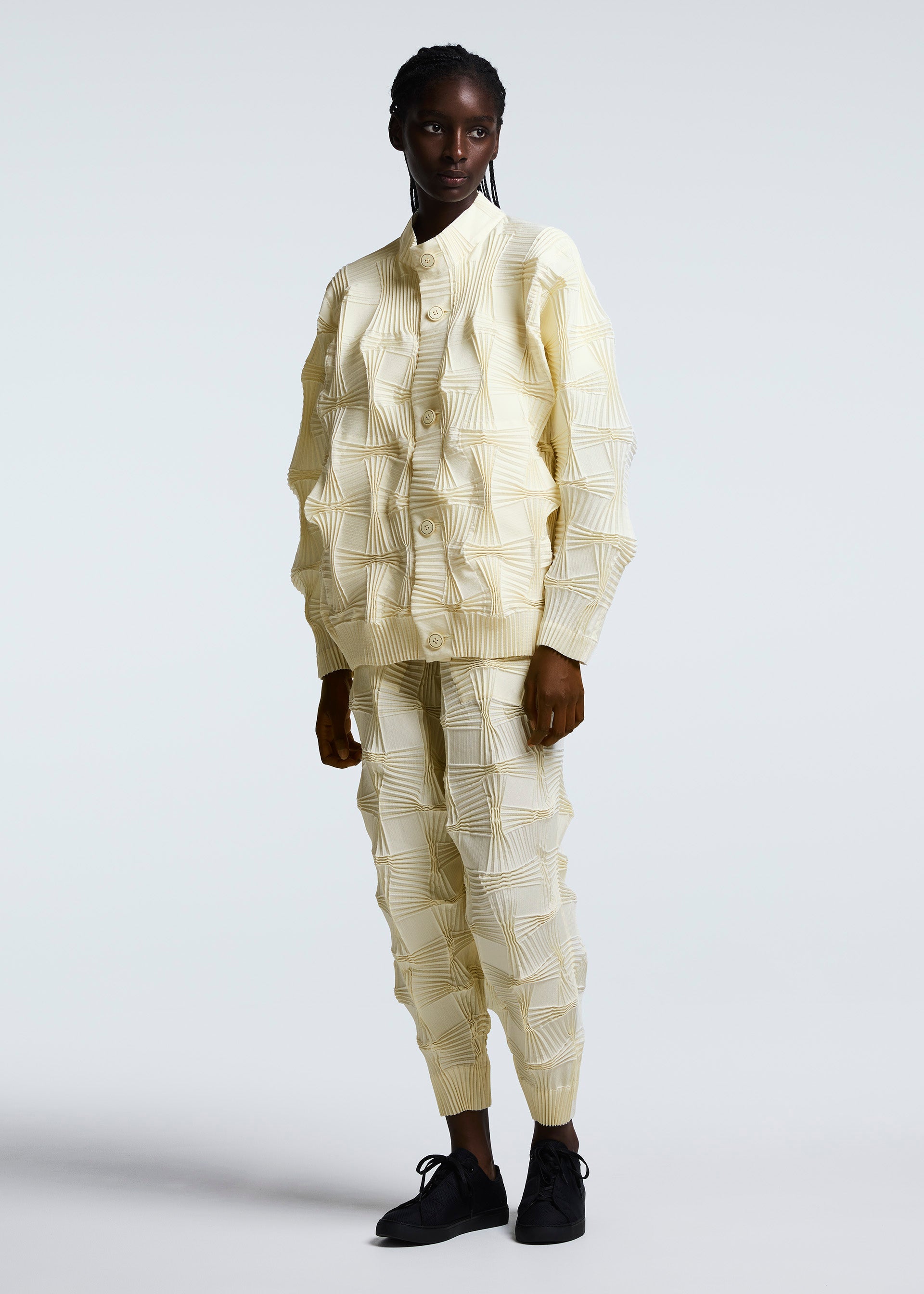 A model wears the A-POC ABLE ISSEY MIYAKE TYPE O 018 trousers.
