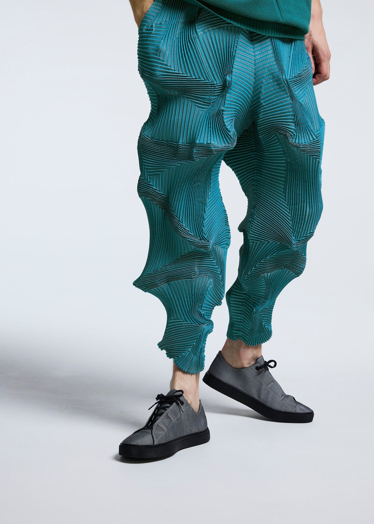 A model wears the A-POC ABLE ISSEY MIYAKE TYPE O 003 trousers.