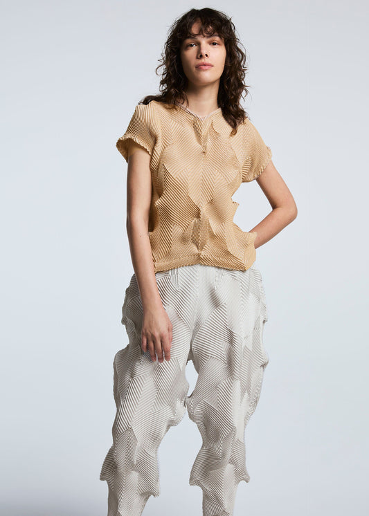 A model wears the A-POC ABLE ISSEY MIYAKE TYPE O 010 trousers.