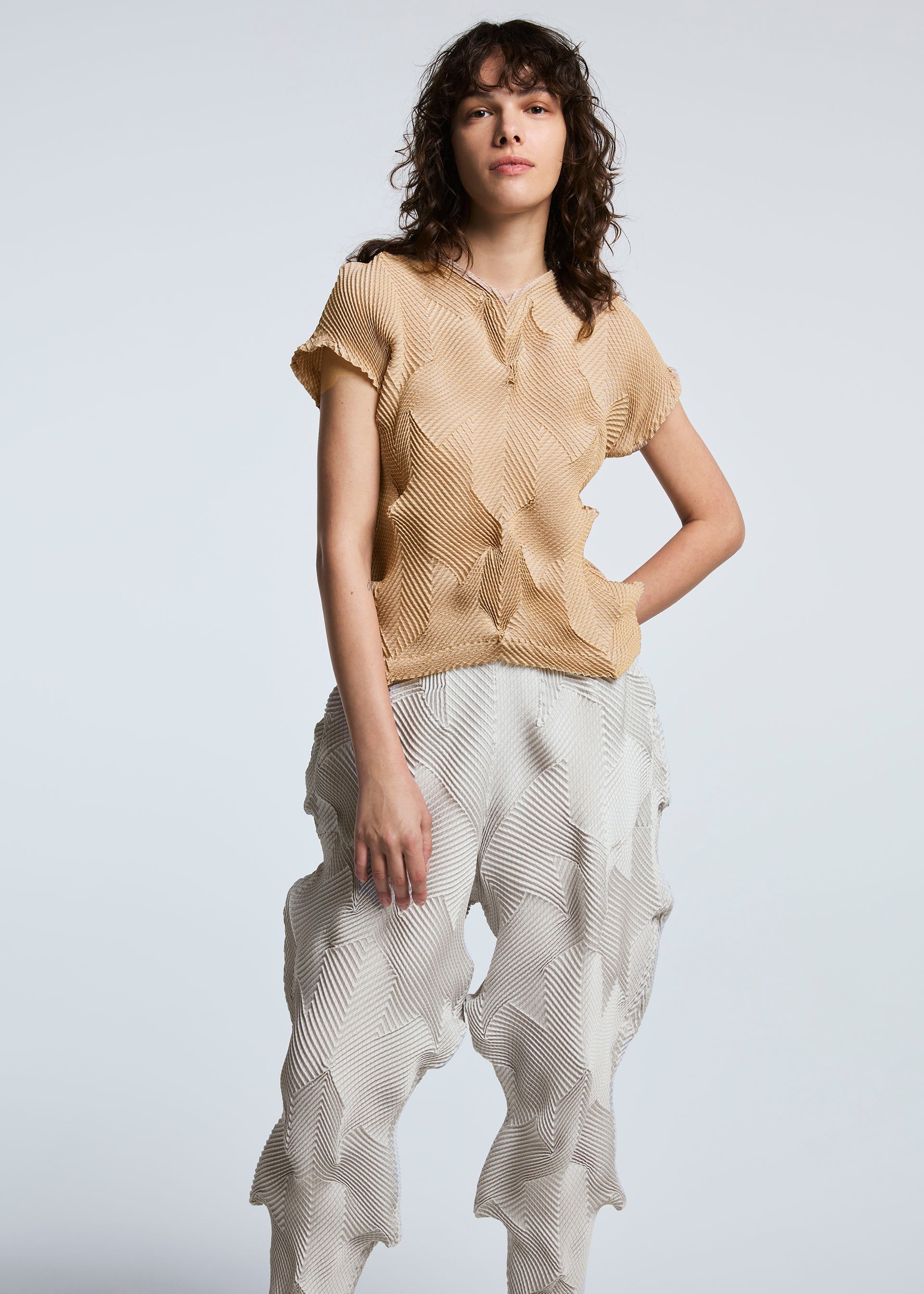 A model wears the A-POC ABLE ISSEY MIYAKE TYPE O 010 trousers.