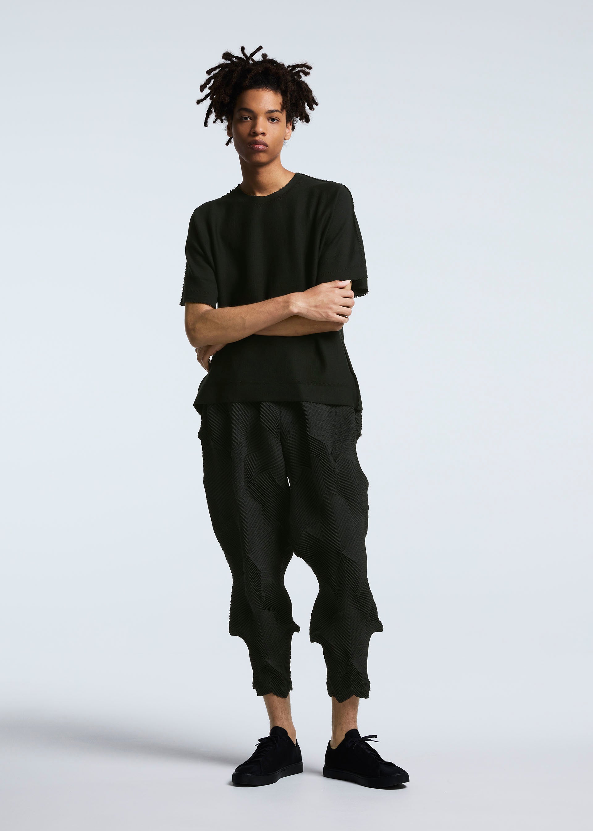 A model wears the A-POC ABLE ISSEY MIYAKE TYPE O 010 trousers.