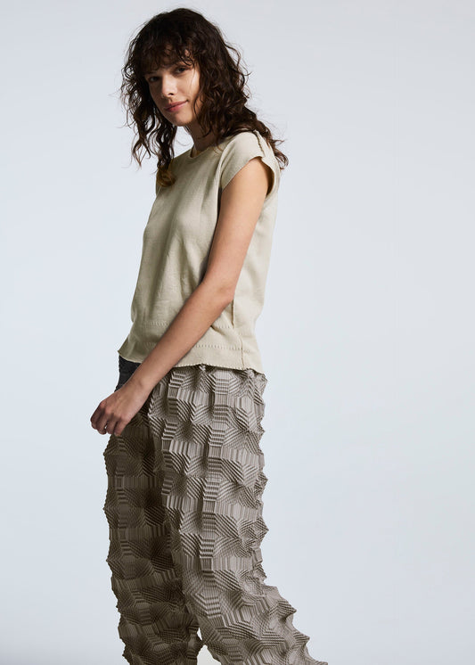 A model wears the A-POC ABLE ISSEY MIYAKE TYPE O 016 trousers.