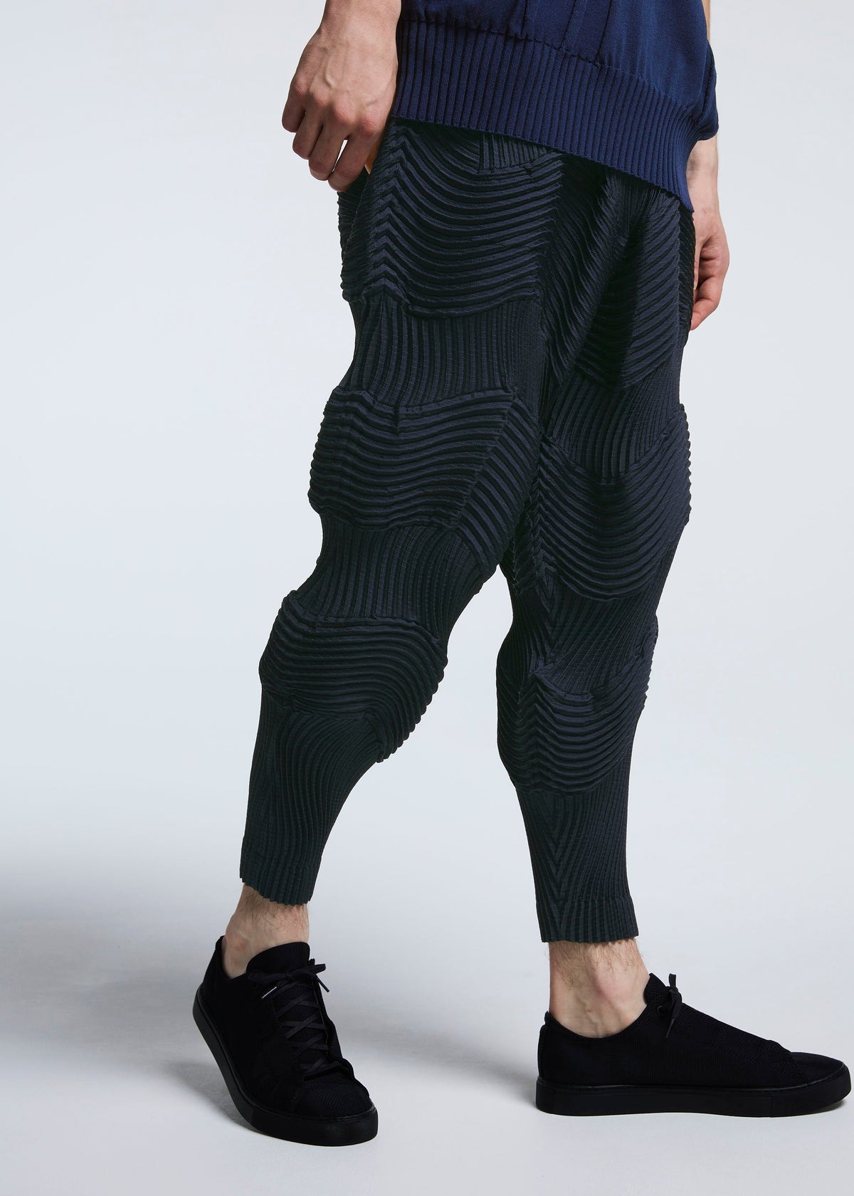 A model wears the A-POC ABLE ISSEY MIYAKE TYPE O 004 trousers.