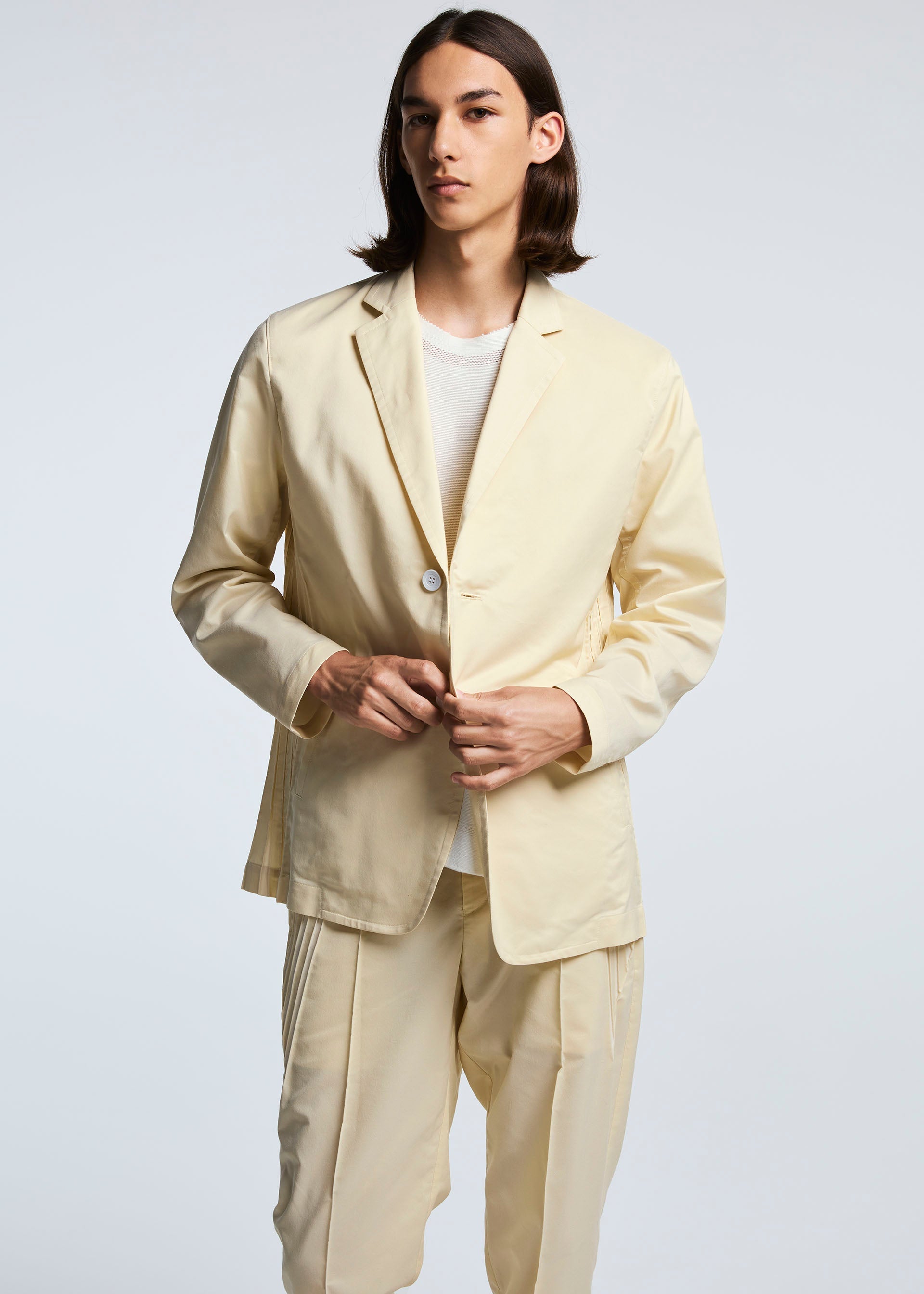 A model wears the A-POC ABLE ISSEY MIYAKE TYPE S 001 1 trousers.