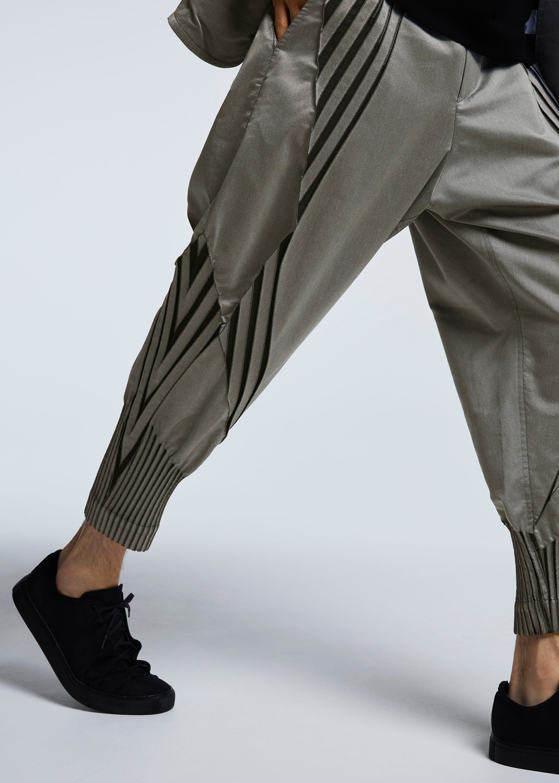 A model wears the A-POC ABLE ISSEY MIYAKE TYPE S 001 1 trousers.