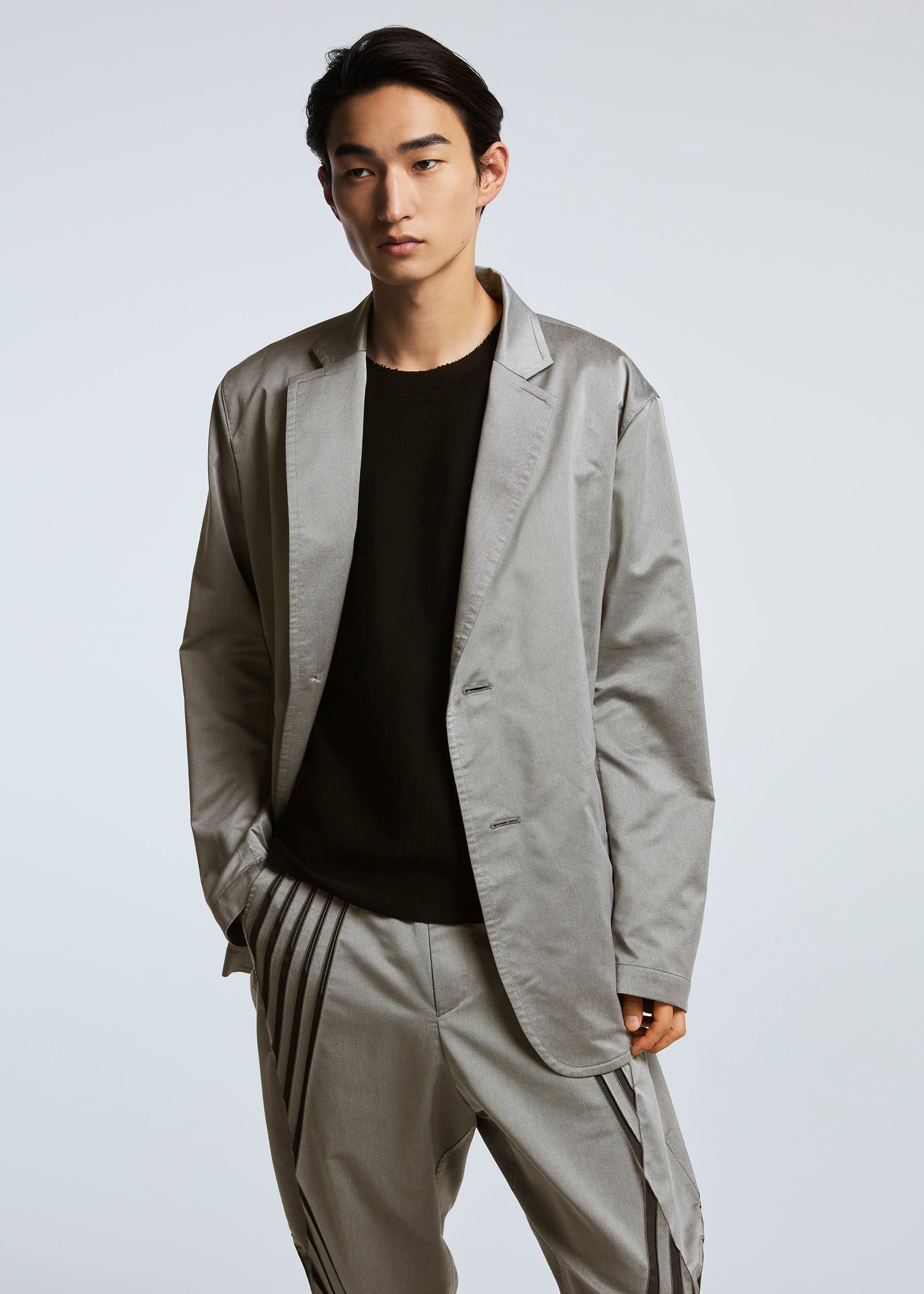 A model wears the A-POC ABLE ISSEY MIYAKE TYPE S 001 1 trousers.