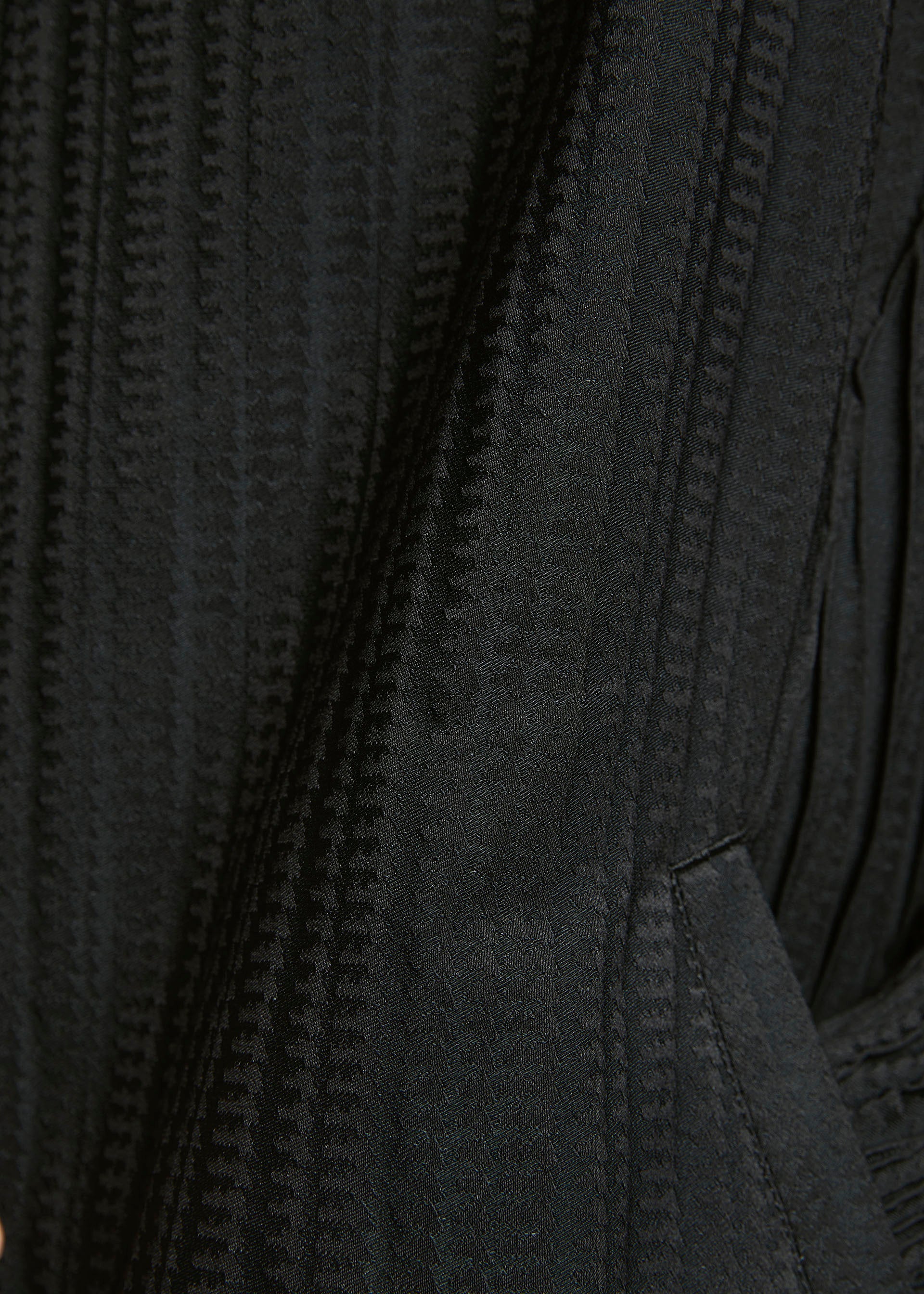 A model wears the A-POC ABLE ISSEY MIYAKE TYPE S 001 2 trousers.