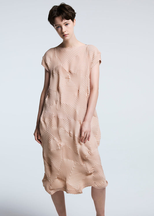 A model wears the A-POC ABLE ISSEY MIYAKE TYPE P 003 dress.