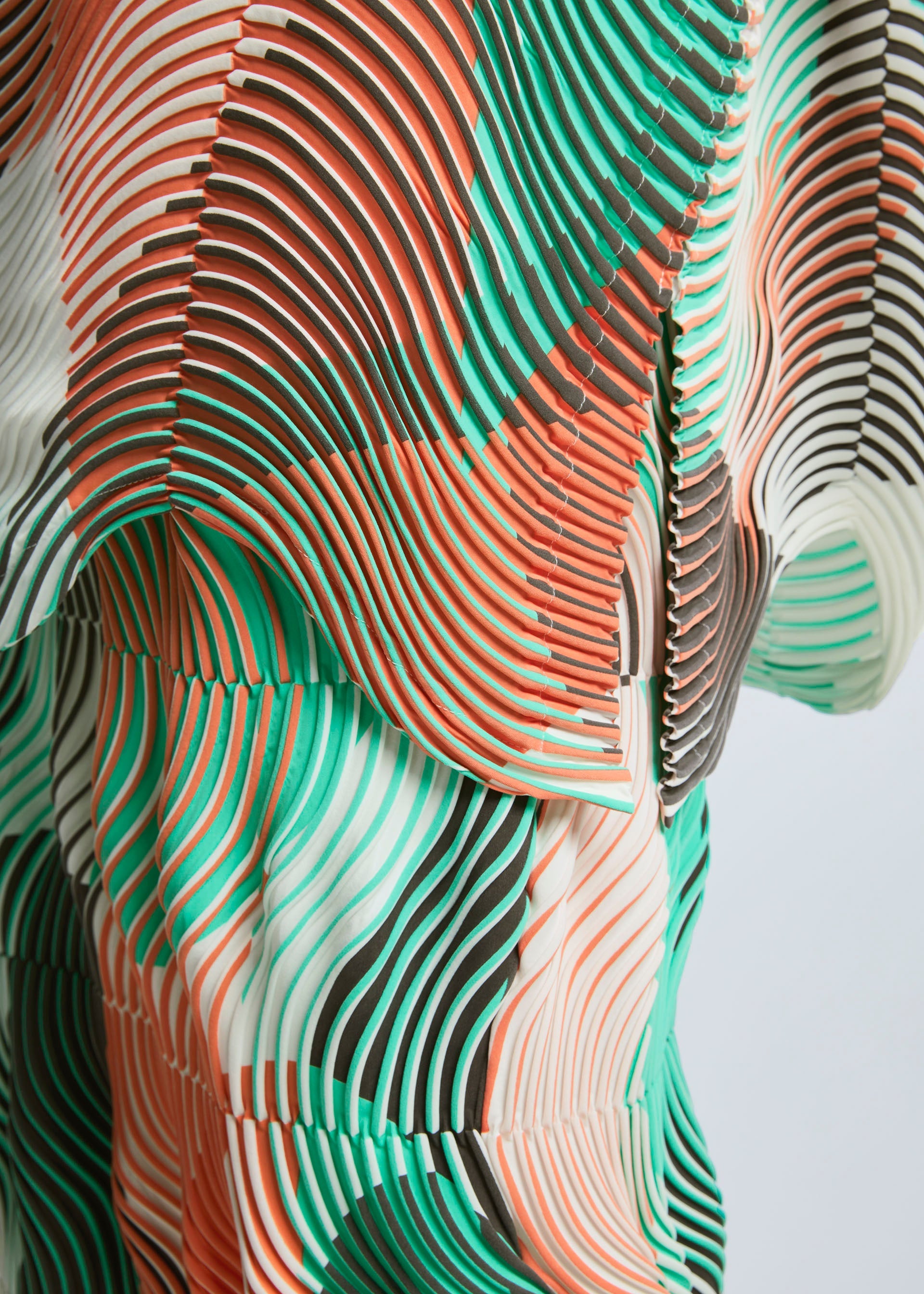 A model wears the A-POC ABLE ISSEY MIYAKE TYPE P 001 top.