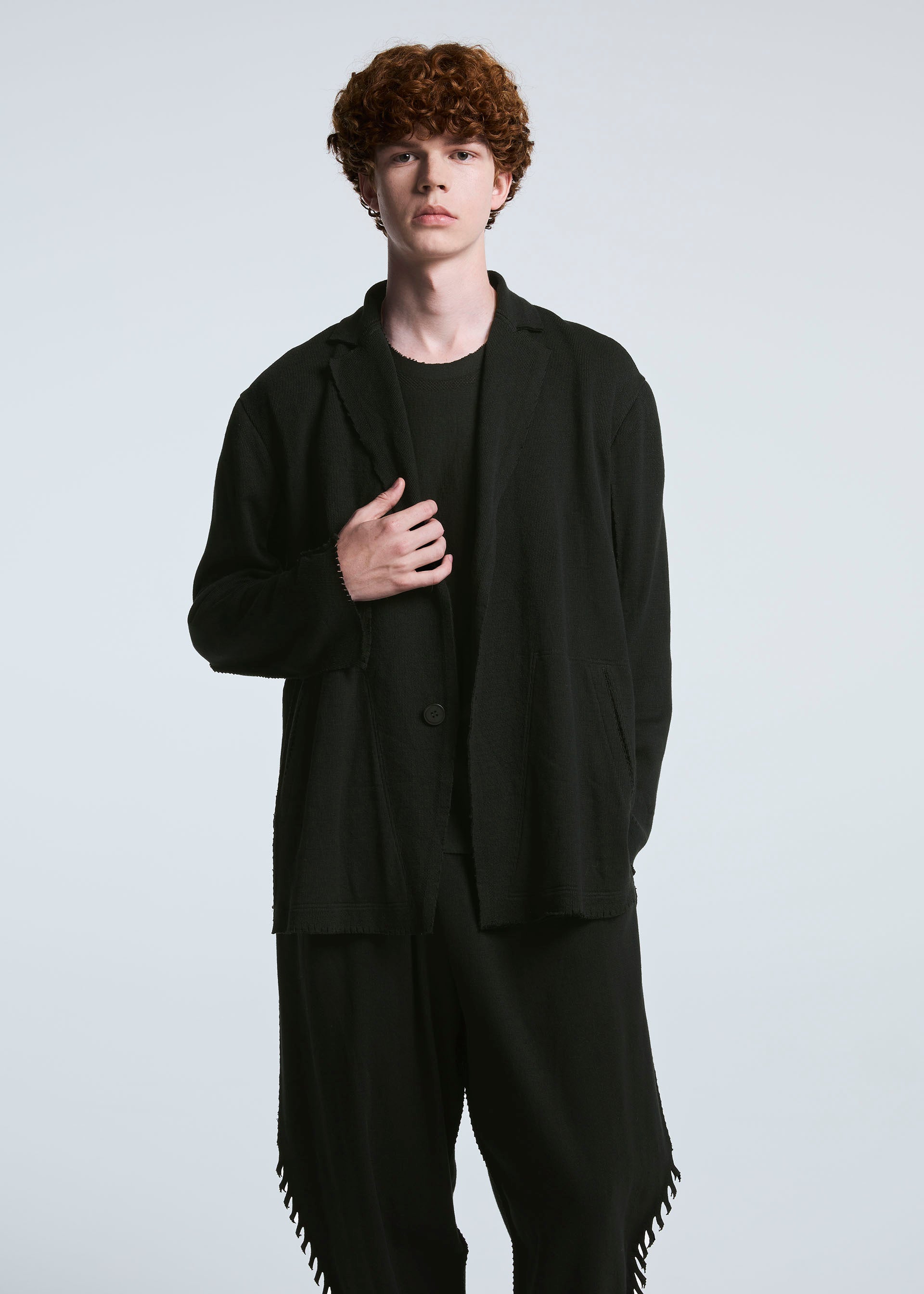A model wears the A-POC ABLE ISSEY MIYAKE TYPE A 003 trousers.