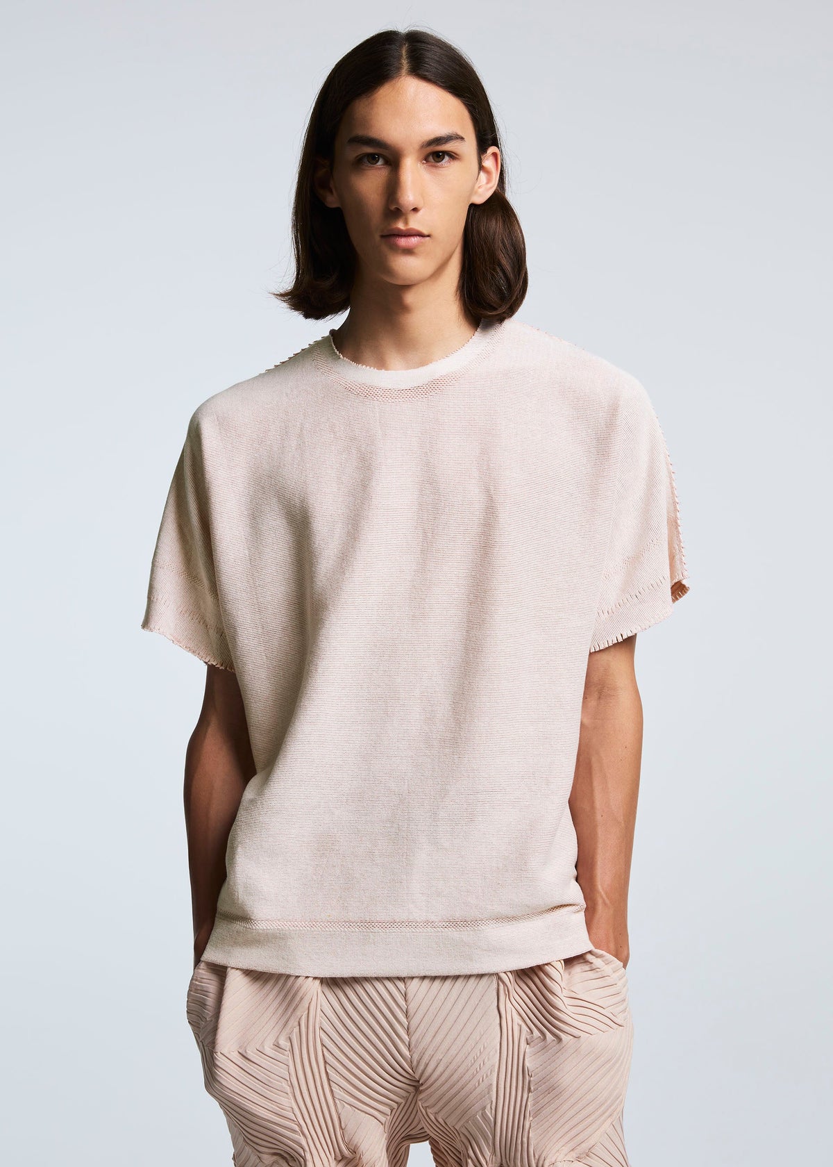 A model wears the A-POC ABLE ISSEY MIYAKE TYPE A 001 1 top.