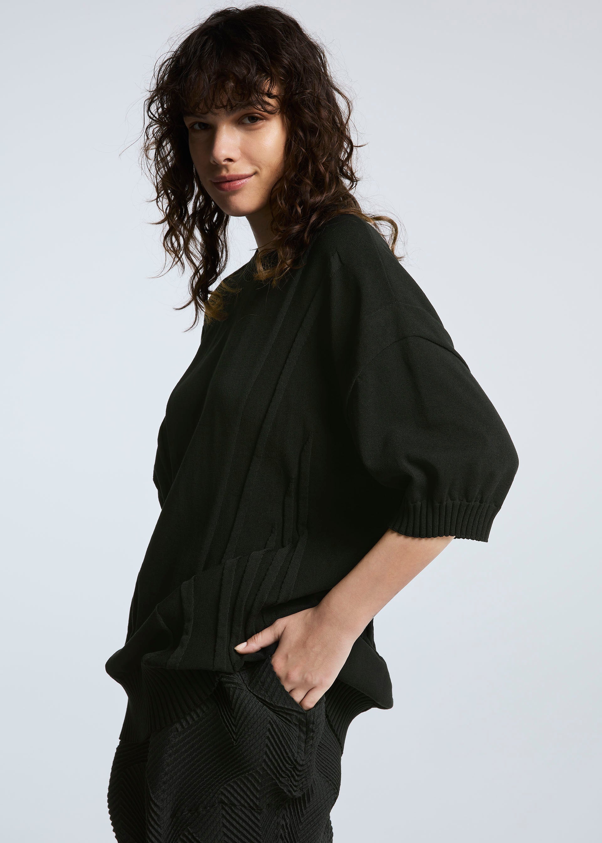 A model wears the A-POC ABLE ISSEY MIYAKE TYPE K 003 2 top.