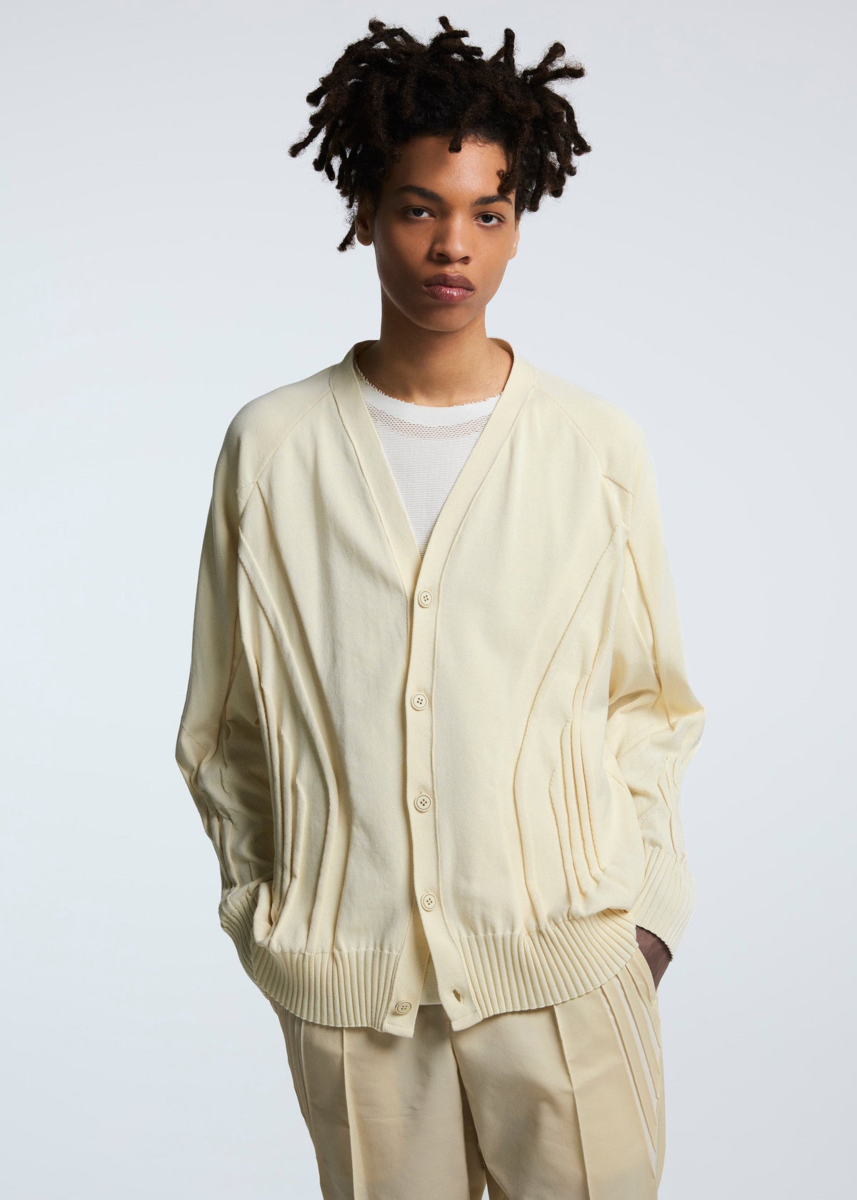 A model wears the A-POC ABLE ISSEY MIYAKE TYPE K 003 1 cardigan.