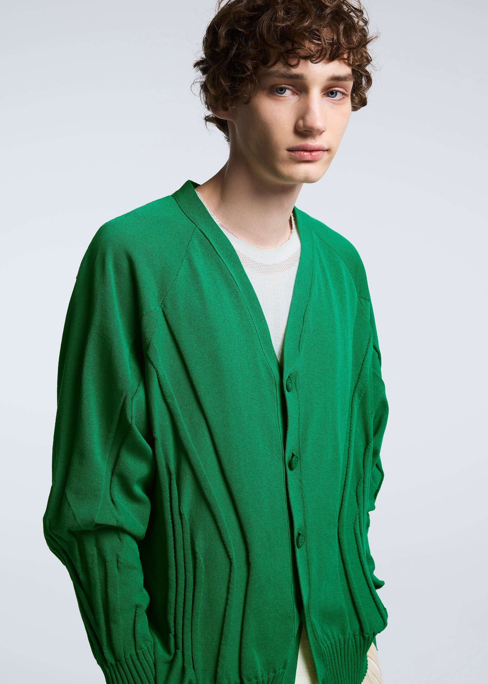 A model wears the A-POC ABLE ISSEY MIYAKE TYPE K 003 1 cardigan.