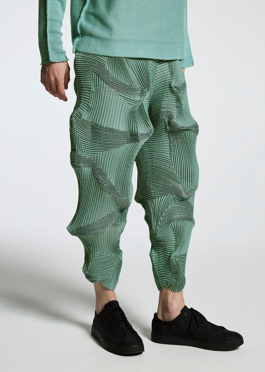 A model wears the A-POC ABLE ISSEY MIYAKE TYPE O 003 trousers.
