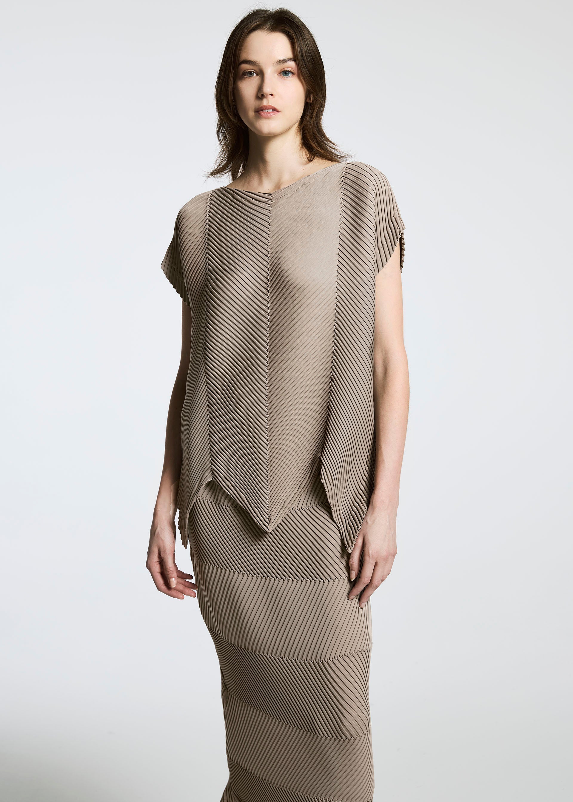 A model wears the A-POC ABLE ISSEY MIYAKE TYPE P 004 skirt.