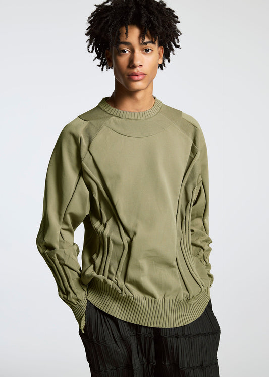 A model wears the A-POC ABLE ISSEY MIYAKE TYPE K 001 top.