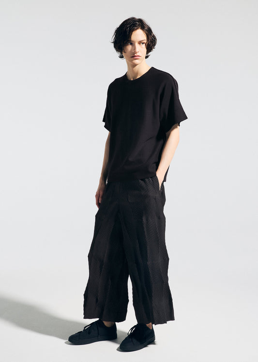 A model wears the A-POC ABLE ISSEY MIYAKE TYPE W 009 1 trousers.