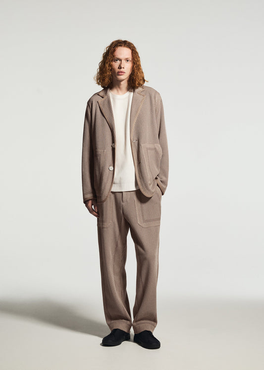 A model wears the A-POC ABLE ISSEY MIYAKE TYPE-K 012 type-k-012-jacket-black-hued.