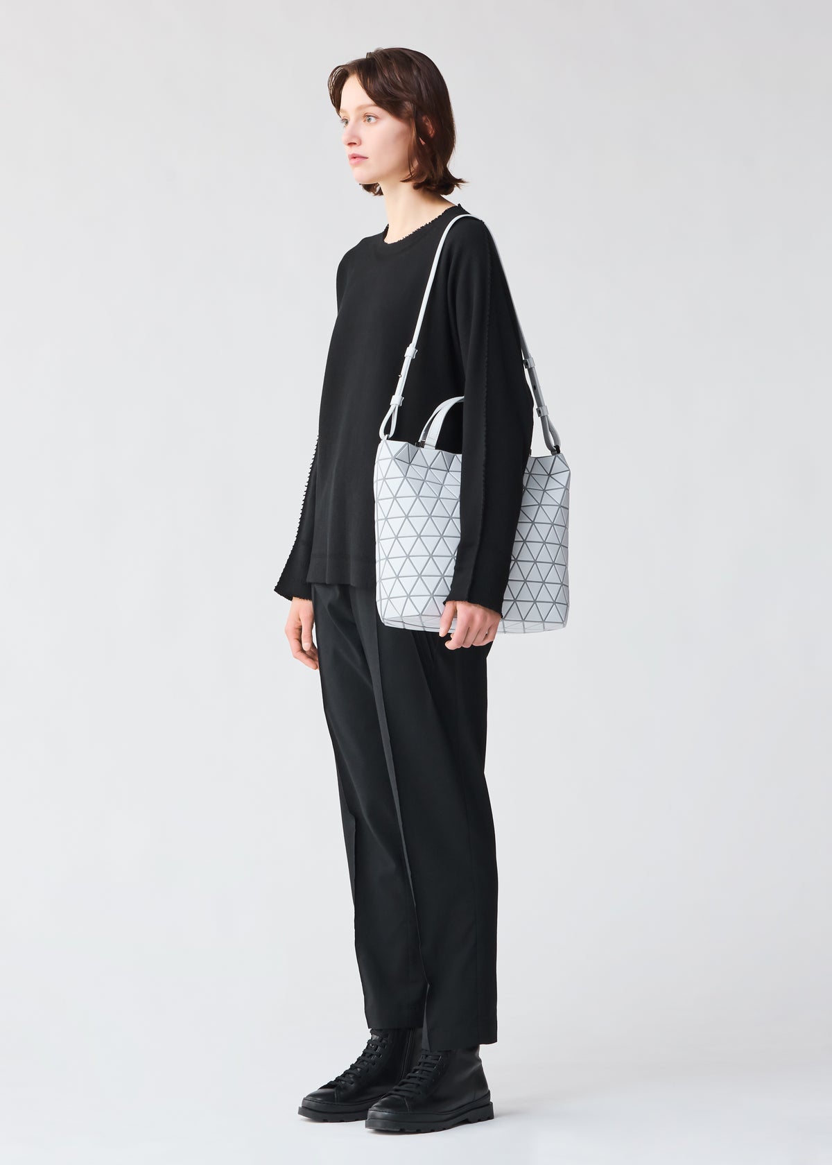 A model wears the BAO BAO ISSEY MIYAKE  CRYSTAL MATTE handbag
