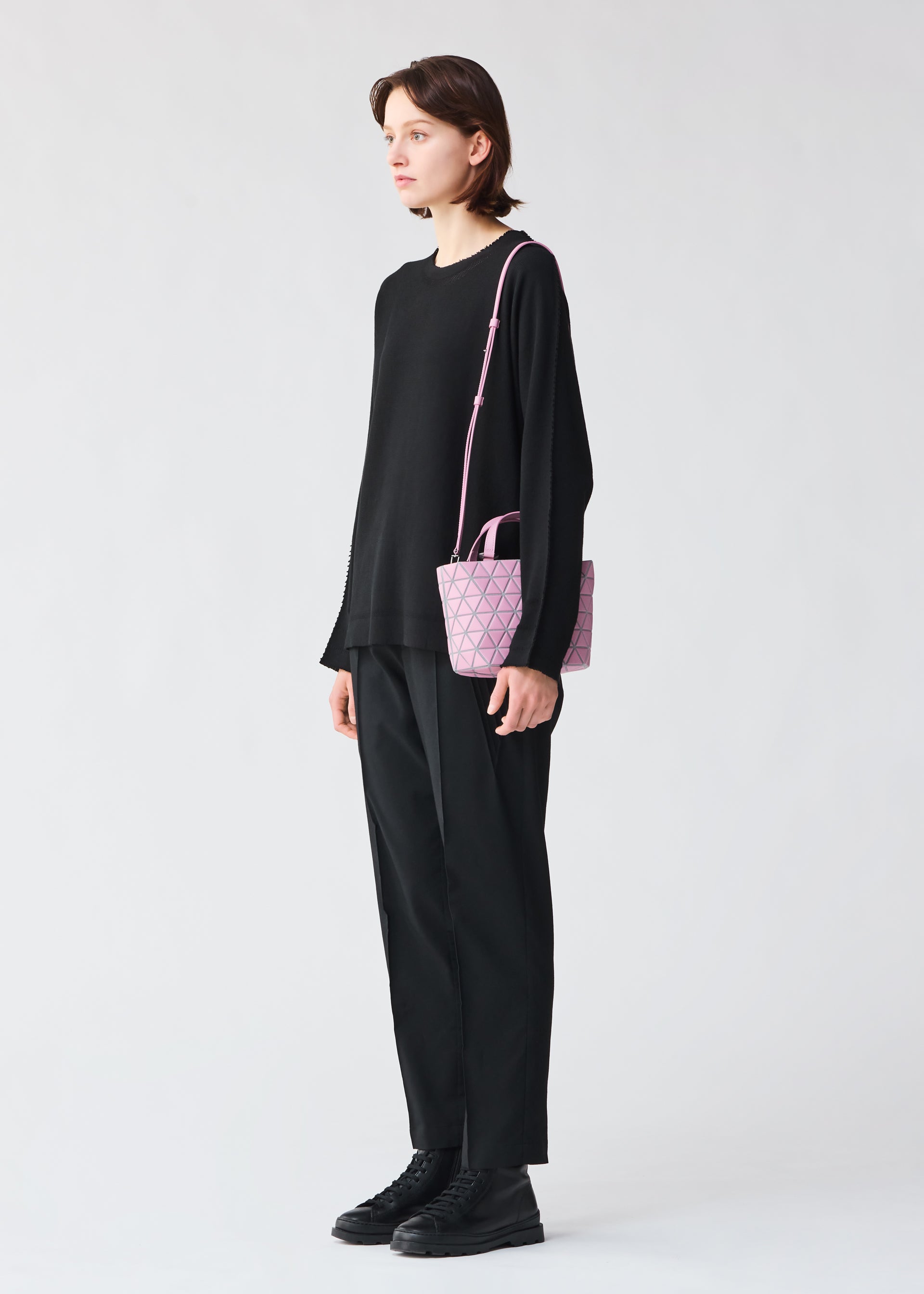 A model wears the BAO BAO ISSEY MIYAKE CRYSTAL MATTE handbag
