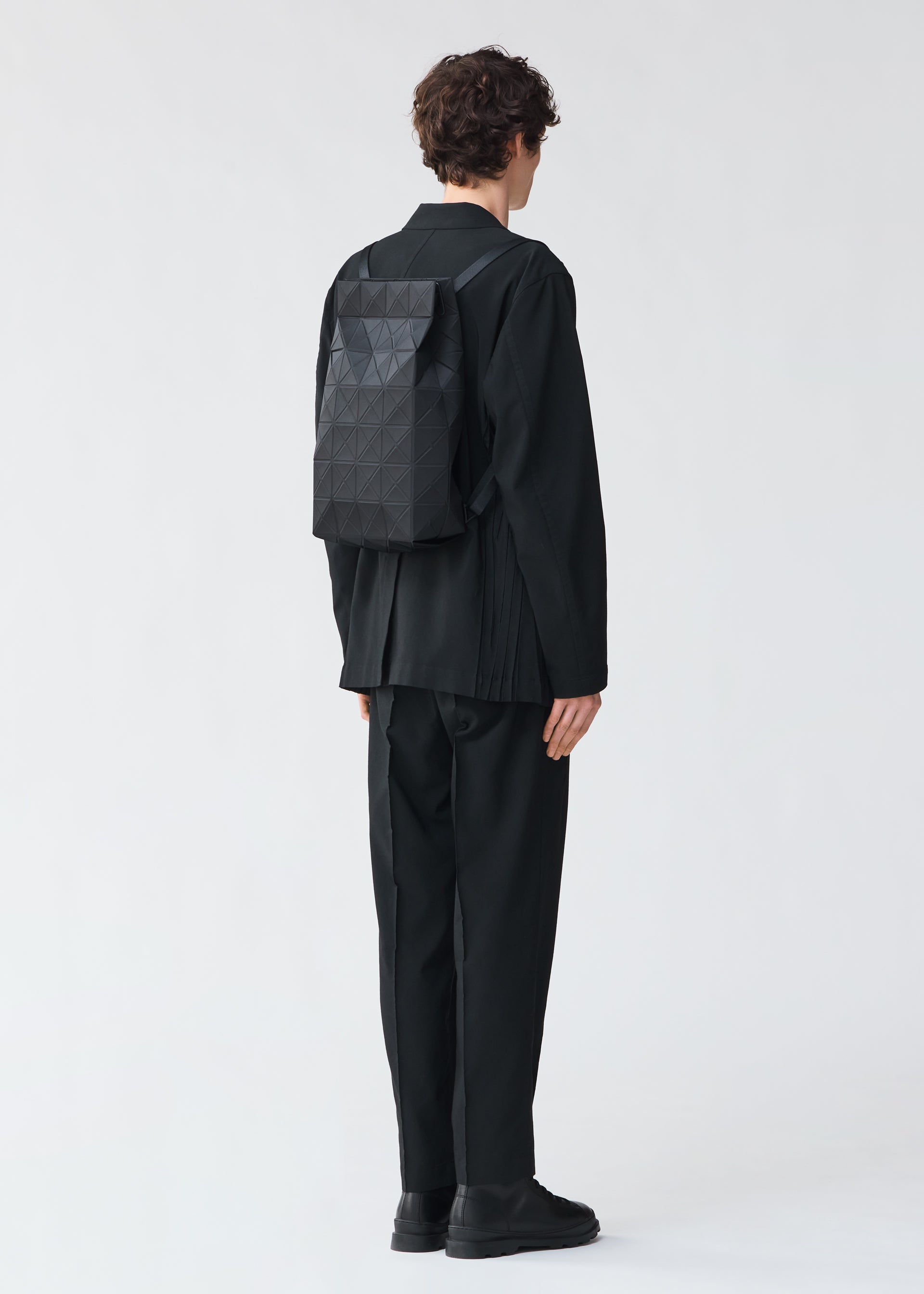 A model wears the BAO BAO ISSEY MIYAKE TRACK backpack.