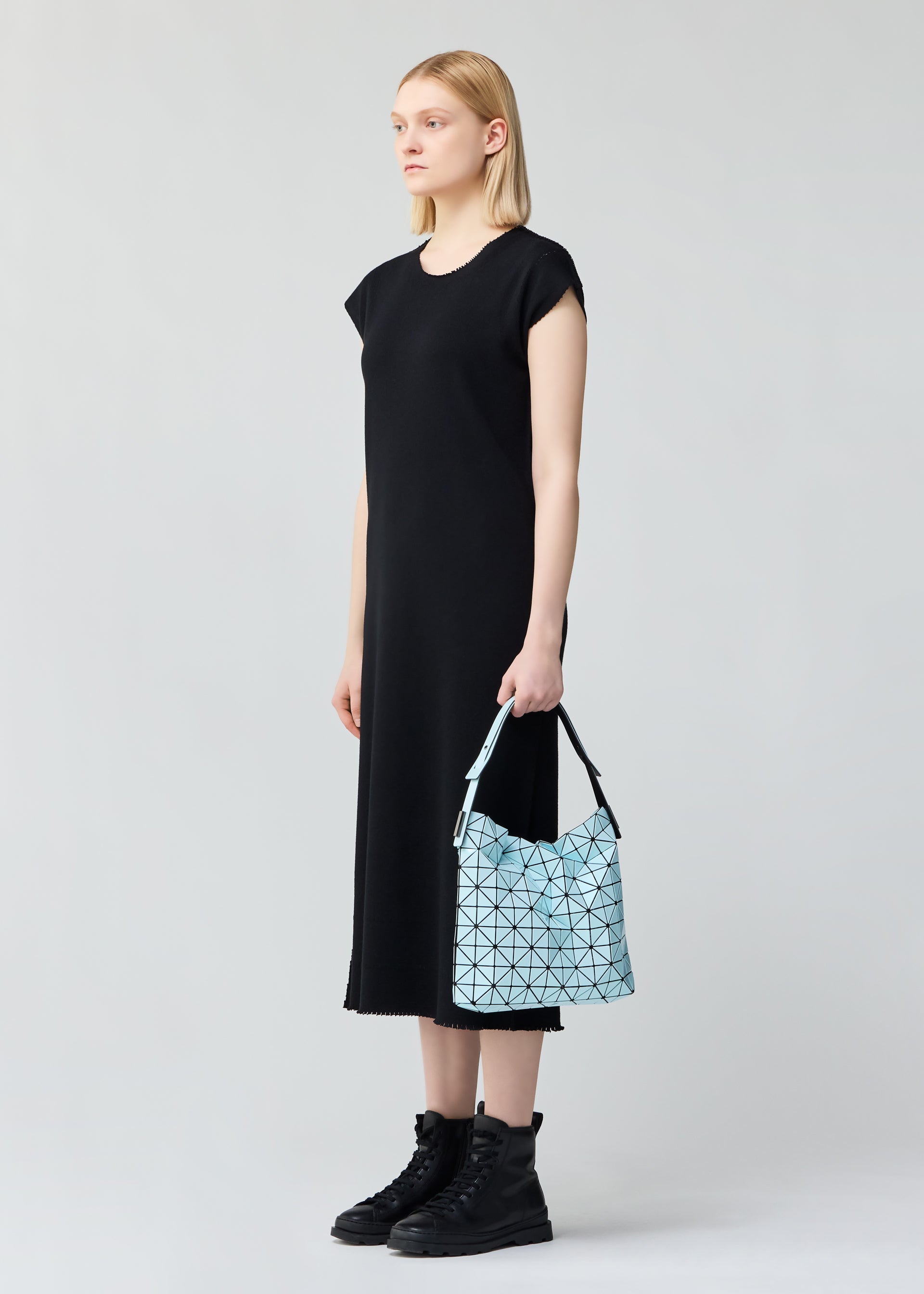 A model wears the BAO BAO ISSEY MIYAKE BAGUETTE .