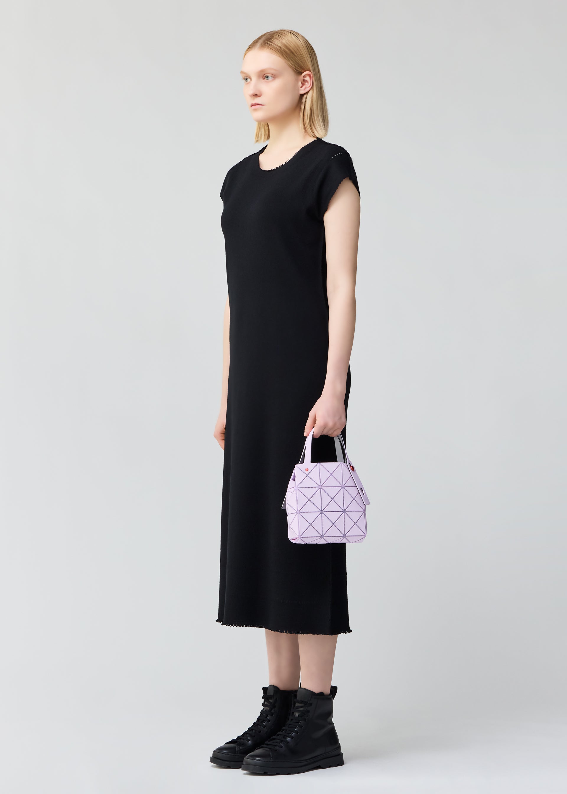 A model wears the BAO BAO ISSEY MIYAKE CARAT hand bag.