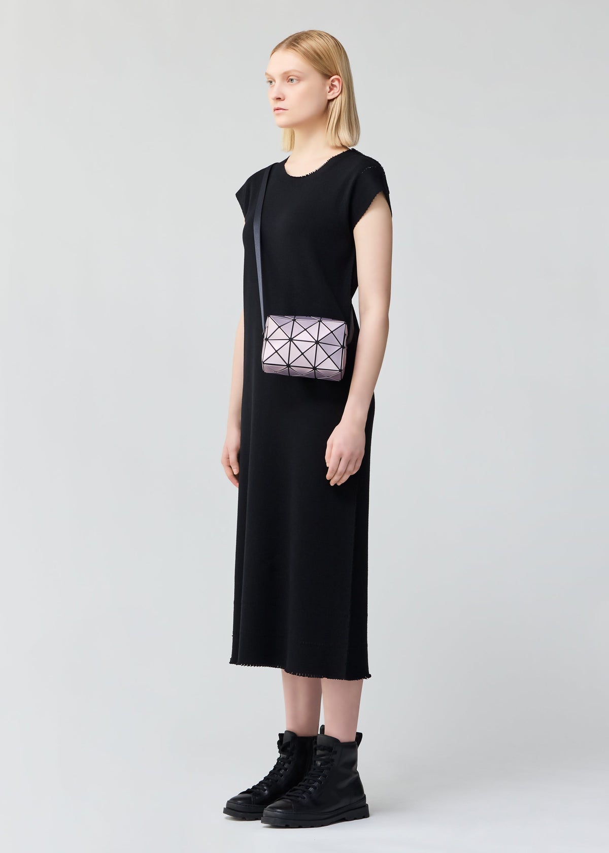 A model wears the BAO BAO ISSEY MIYAKE CUBOID METALLIC shoulder bag.