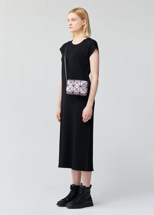 A model wears the BAO BAO ISSEY MIYAKE CUBOID METALLIC shoulder bag.