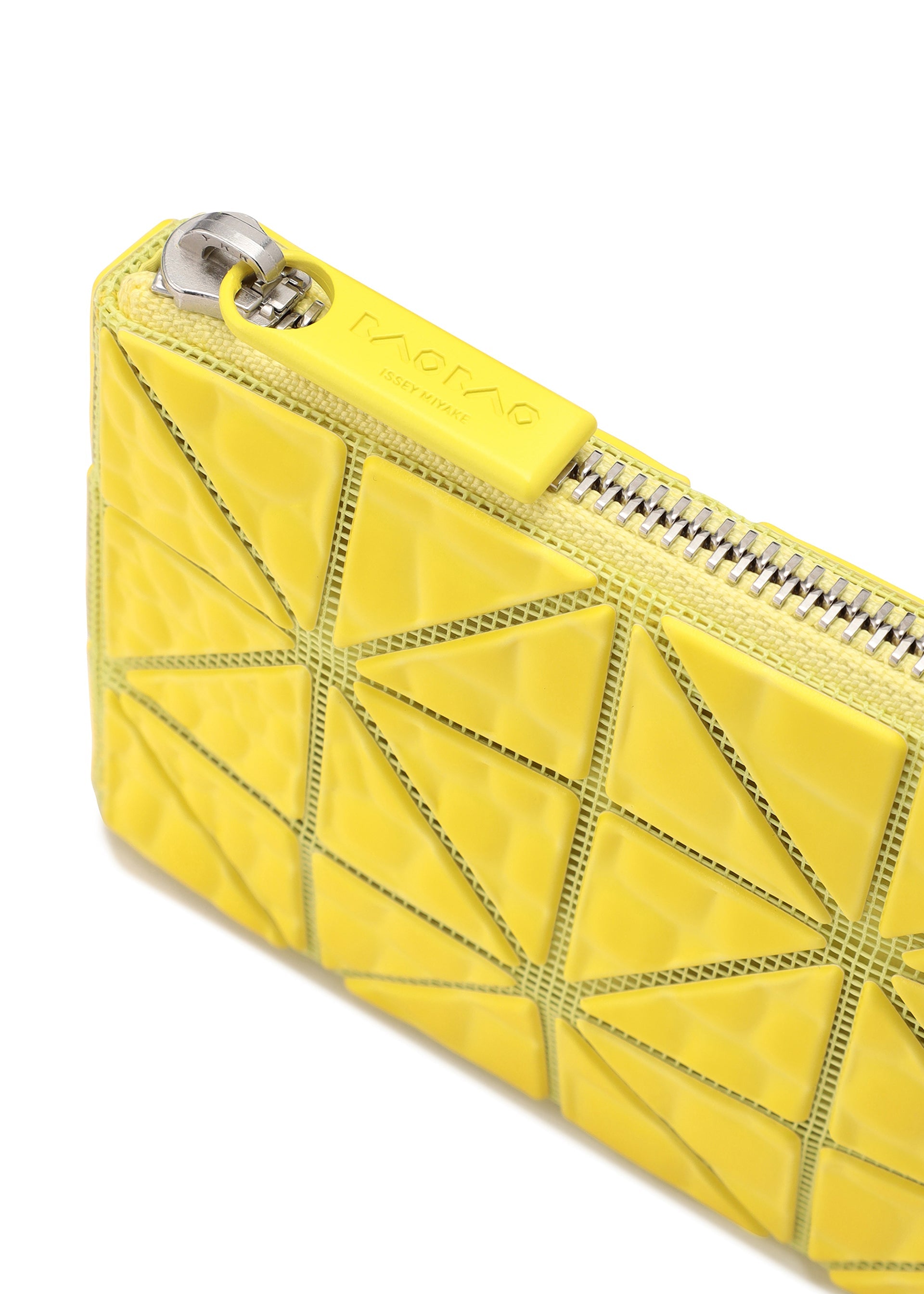 A detail shot of the BAO BAO ISSEY MIYAKE CASSETTE wallet.