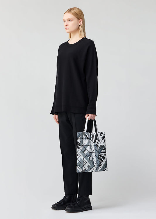 A model wears the BAO BAO ISSEY MIYAKE MANGA tote.