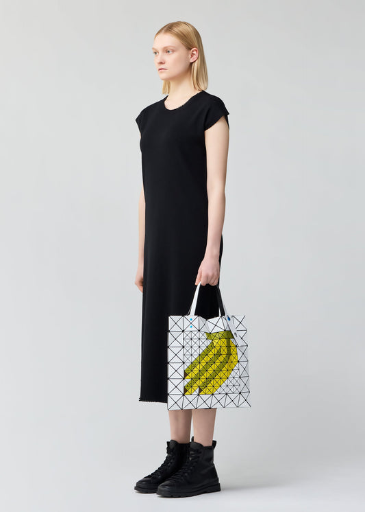 A model wears the BAO BAO ISSEY MIYAKE FRUITS tote.