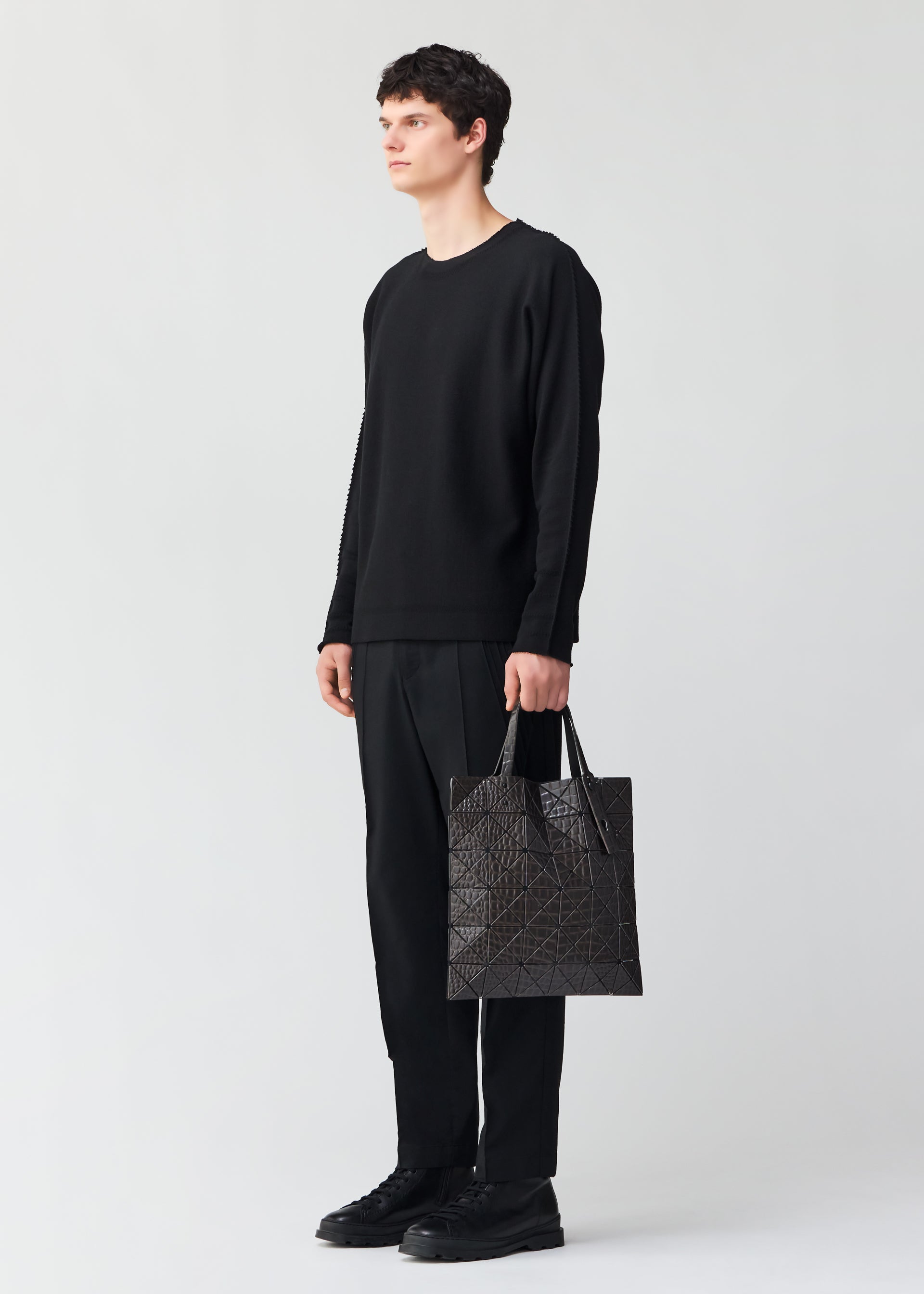 A model wears the BAO BAO ISSEY MIYAKE KAIJU tote.