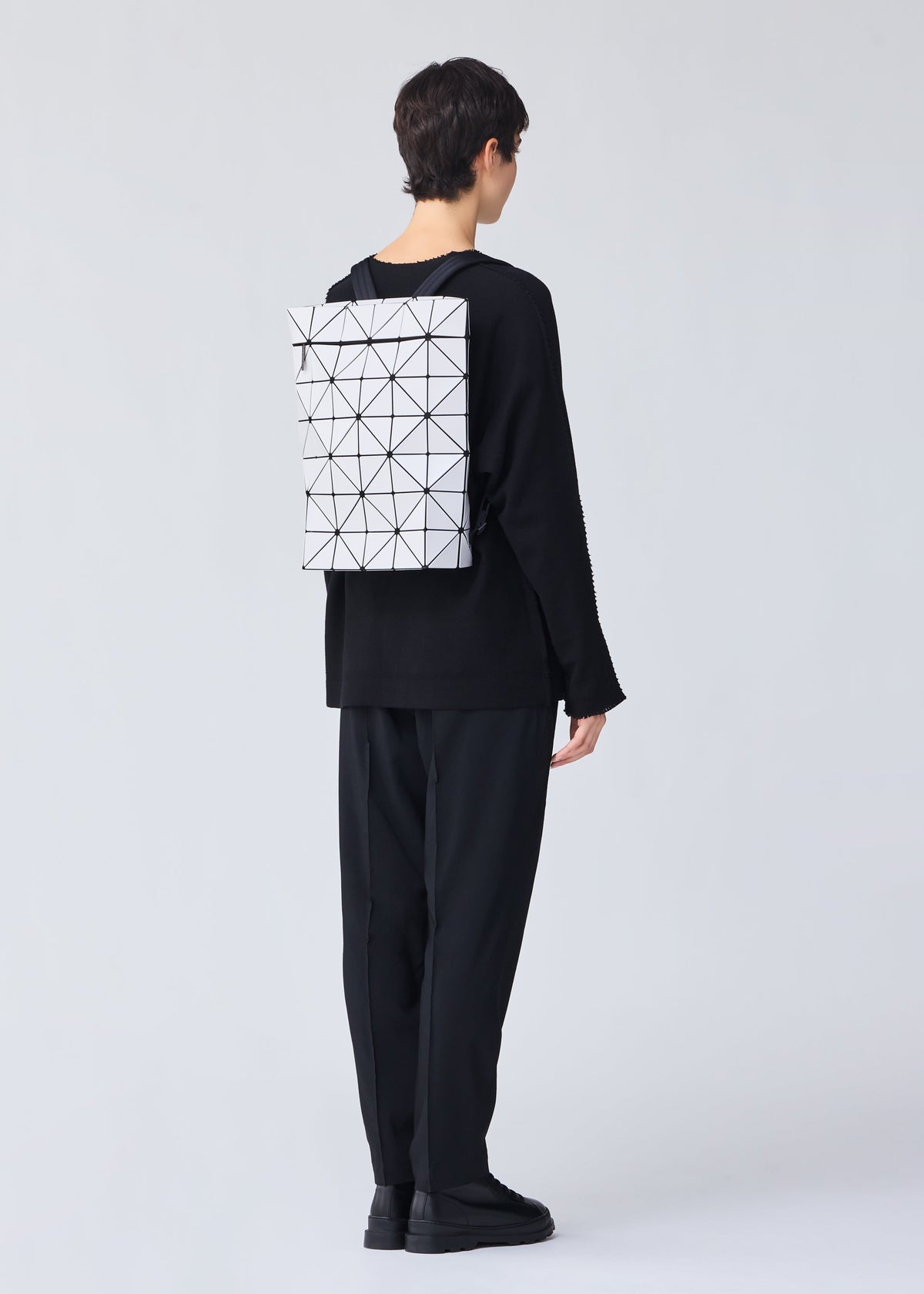 A model wears the BAO BAO ISSEY MIYAKE BLOCKY backpack.