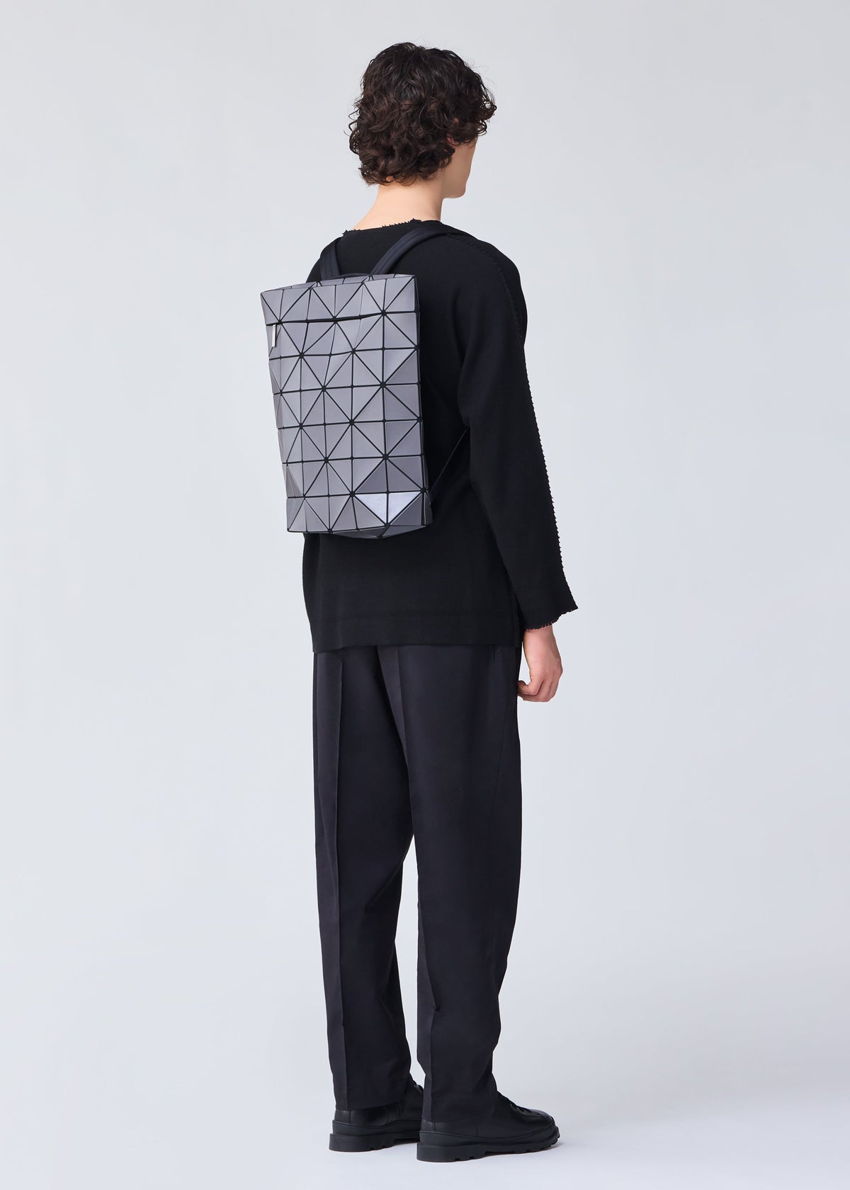 A model wears the BAO BAO ISSEY MIYAKE BLOCKY backpack.