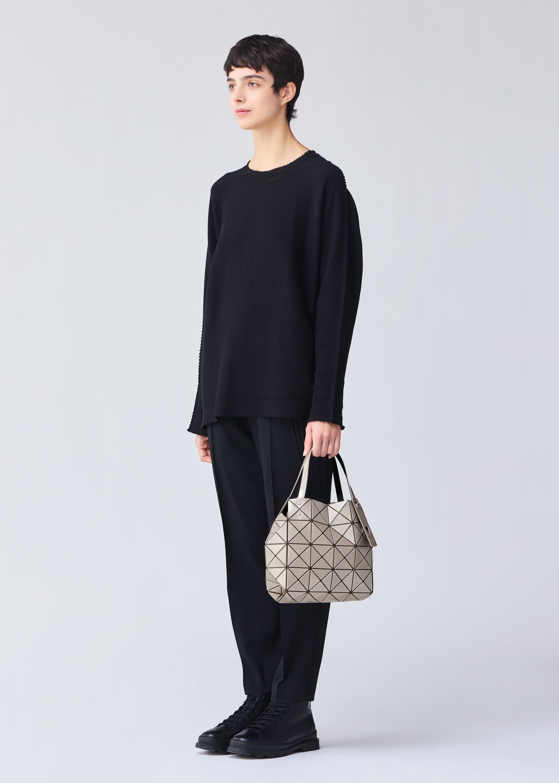 A model wears the BAO BAO ISSEY MIYAKE CARAT 0.